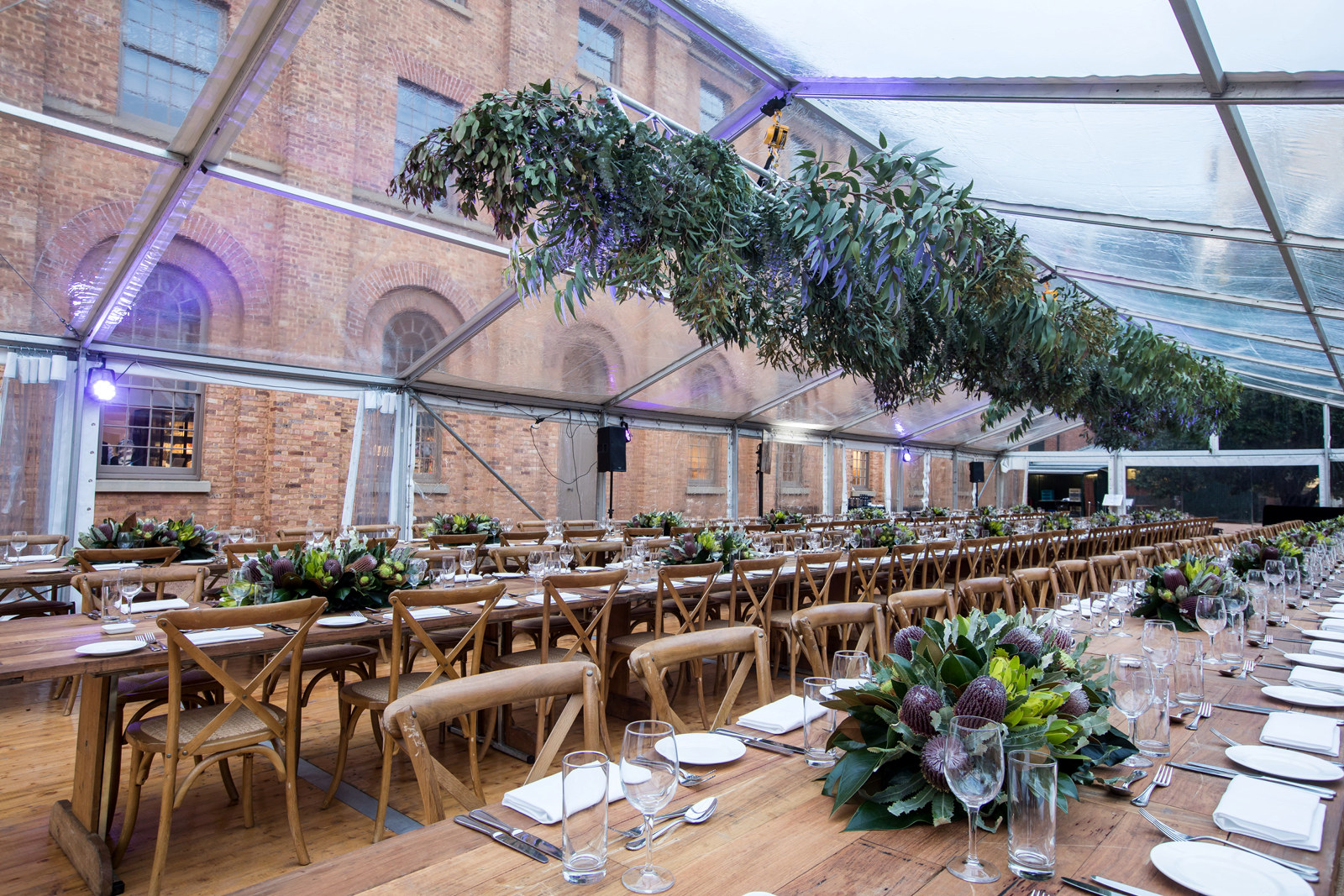 A marquee's table seating for an event in the southern courtyard of Hyde Park Barracks