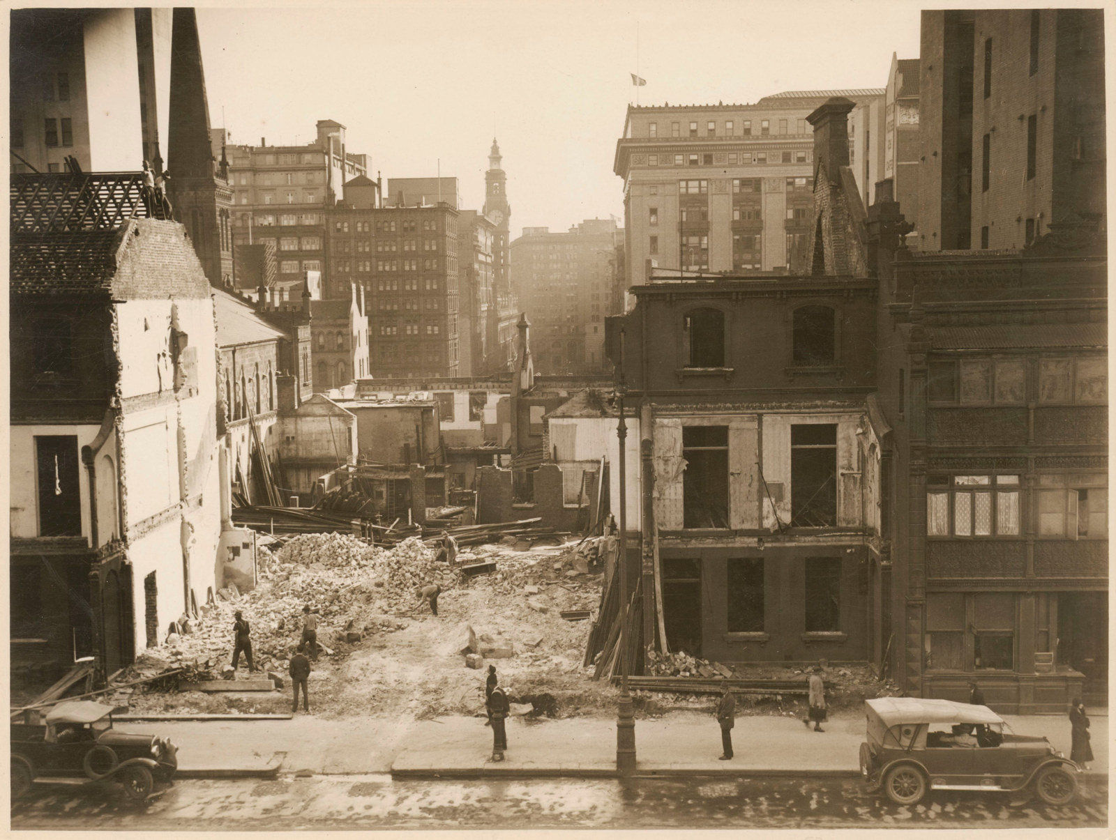 Sepia photograph of demolished buildings in Sydney during the 1930s.