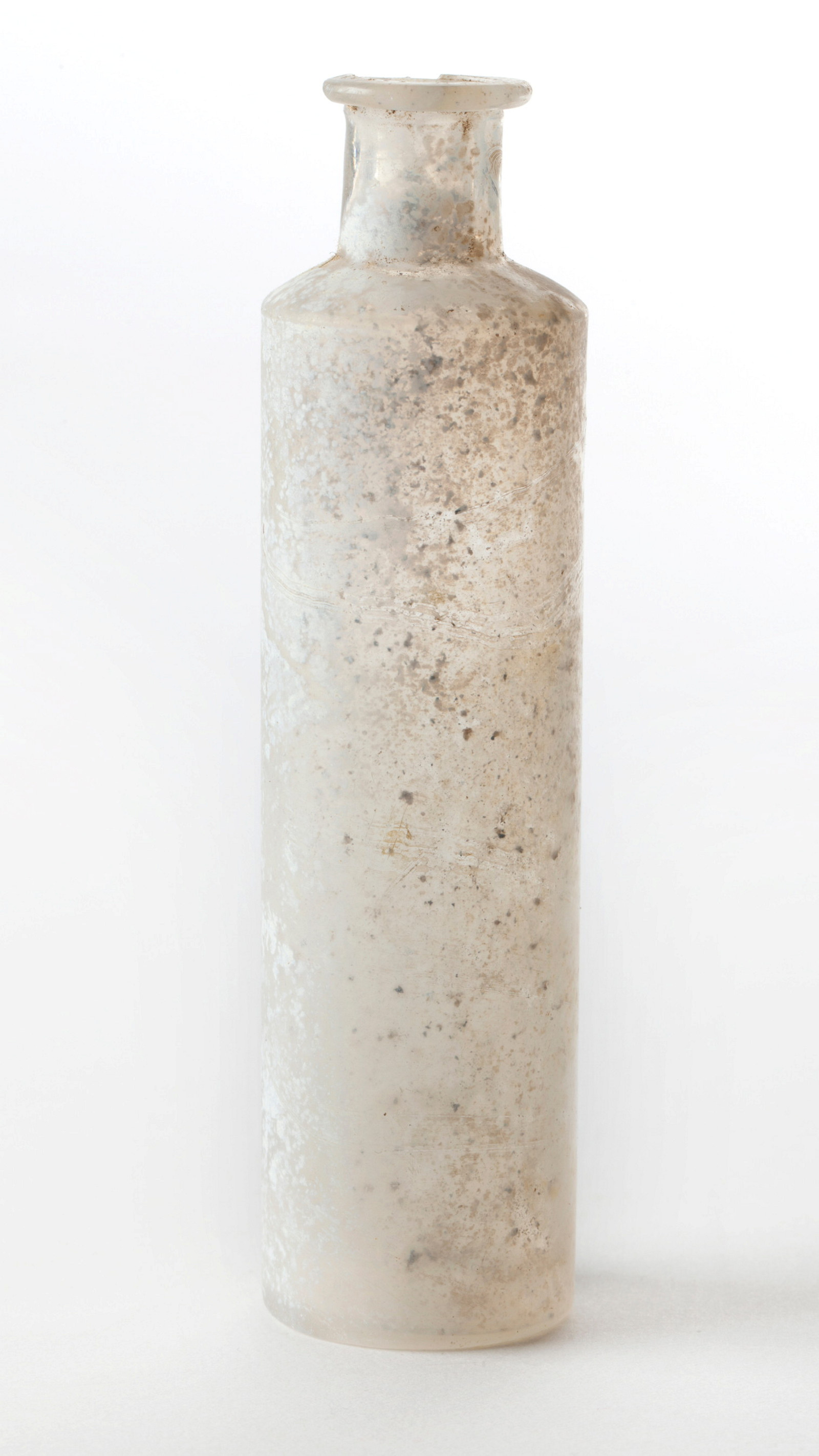 Tall glass bottle with discoloured surface.