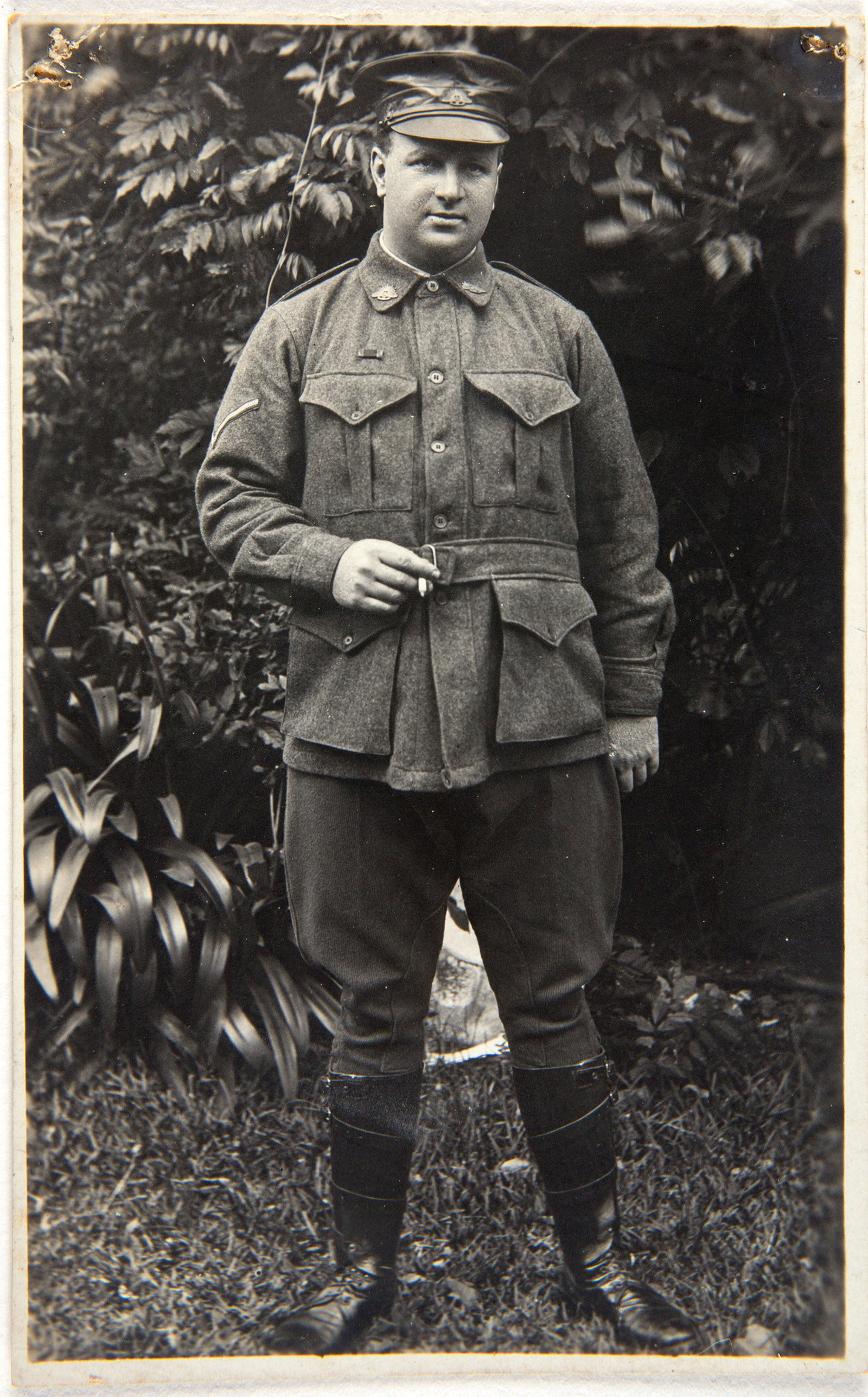 Black and white photo of man in uniform.