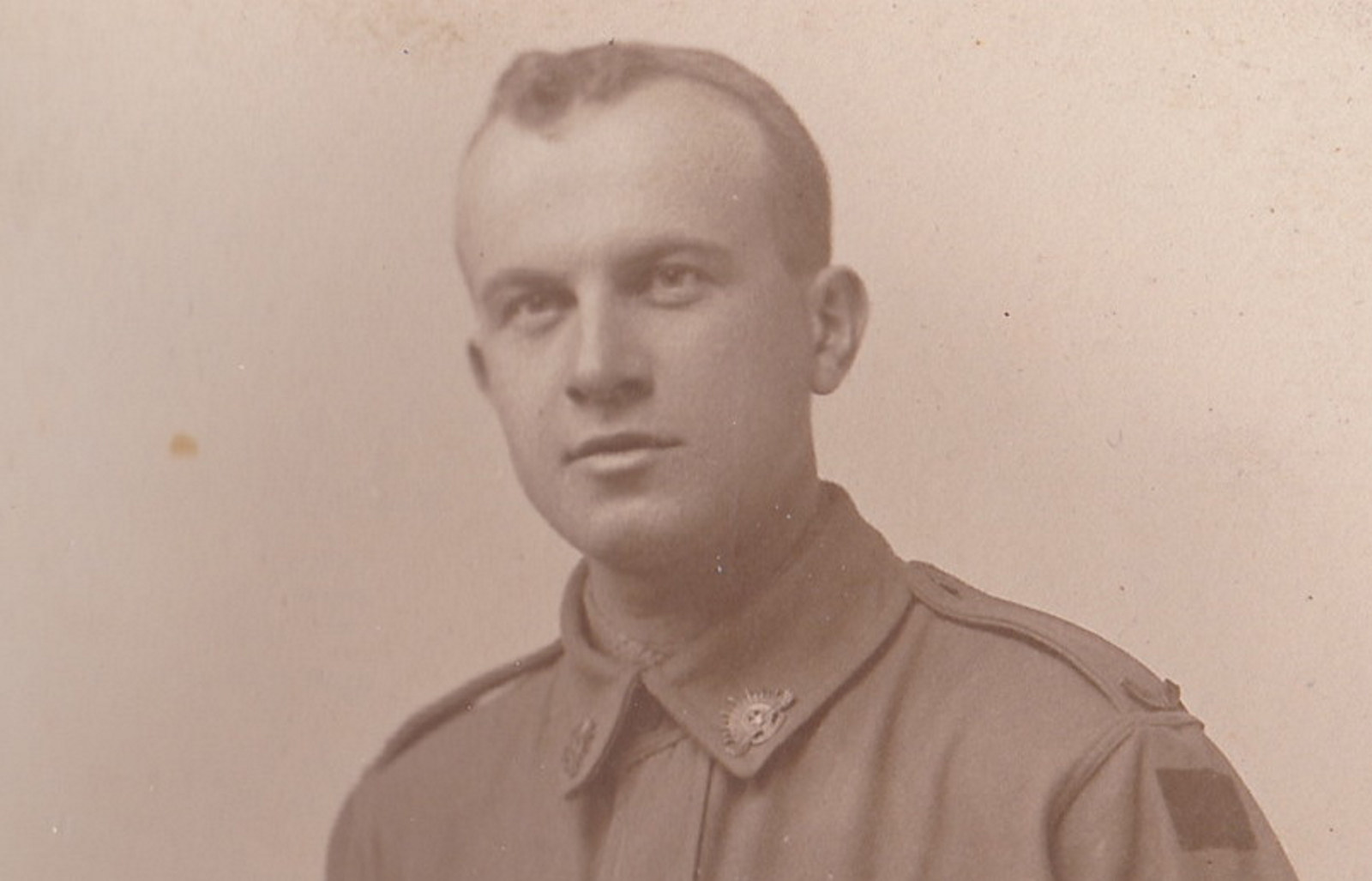 Closeup of man in uniform.