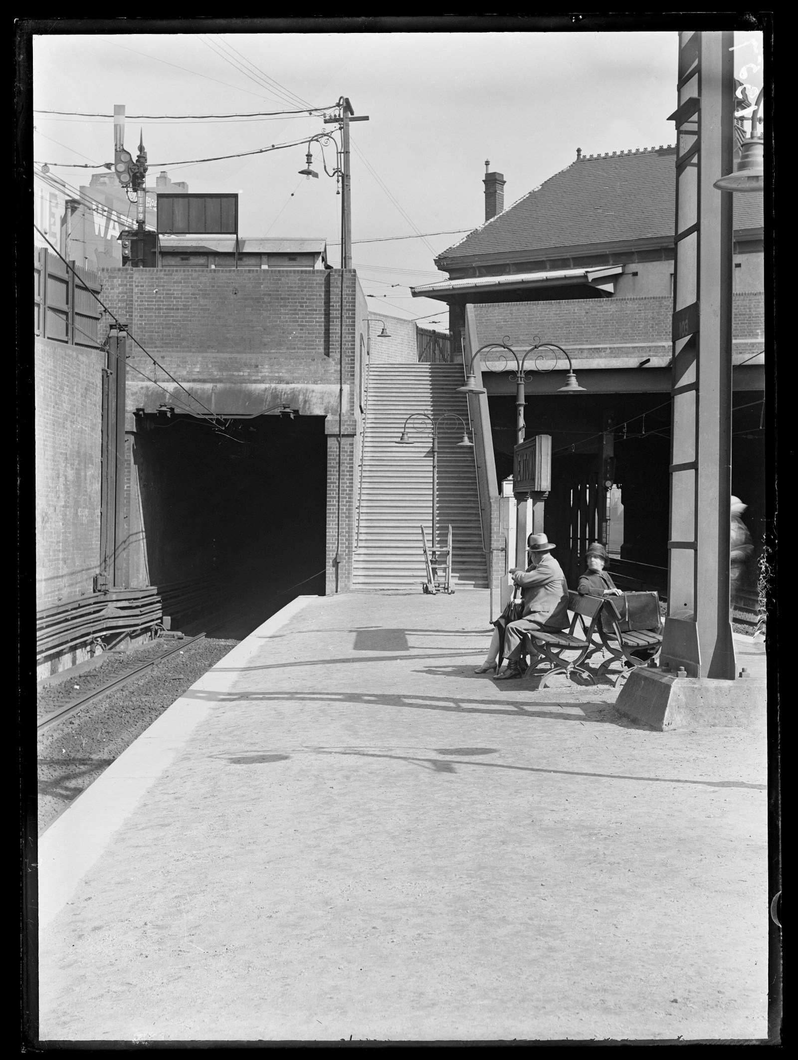 Black and white photo of platform with tunnel to left.