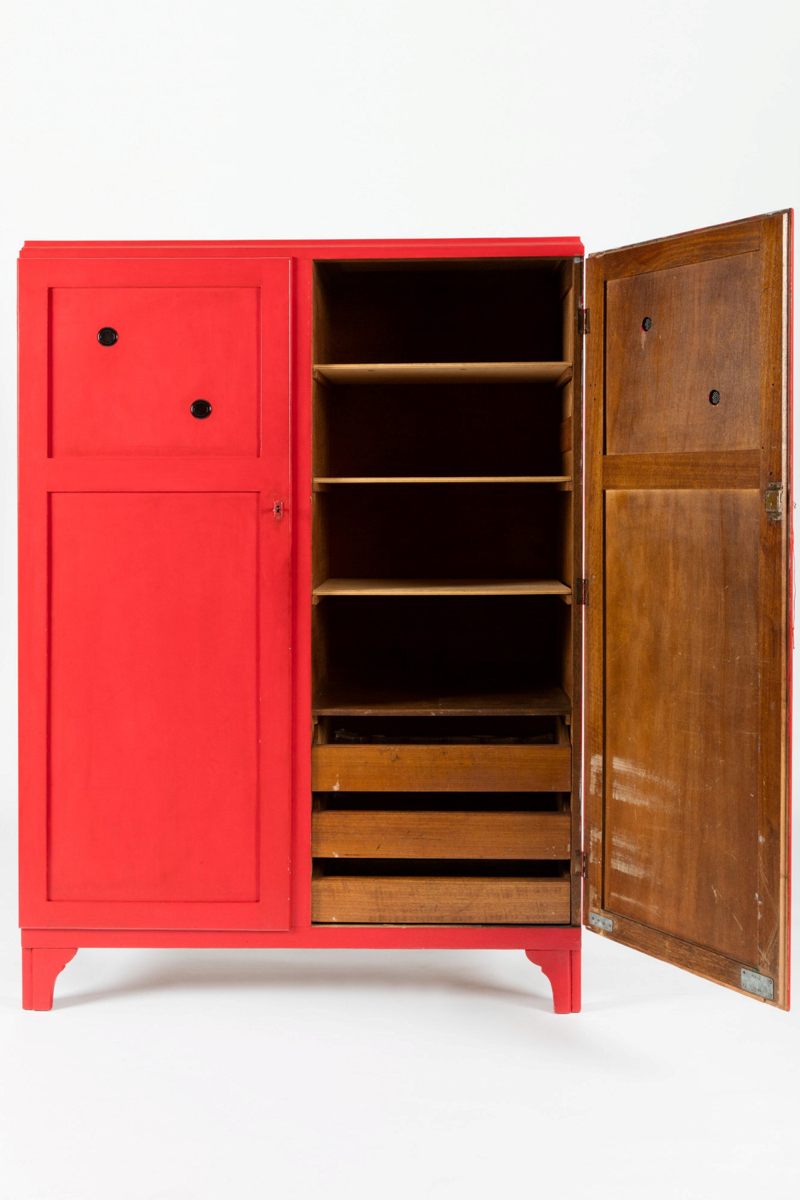 Red timber cupboard with right hand door open to show shelving.