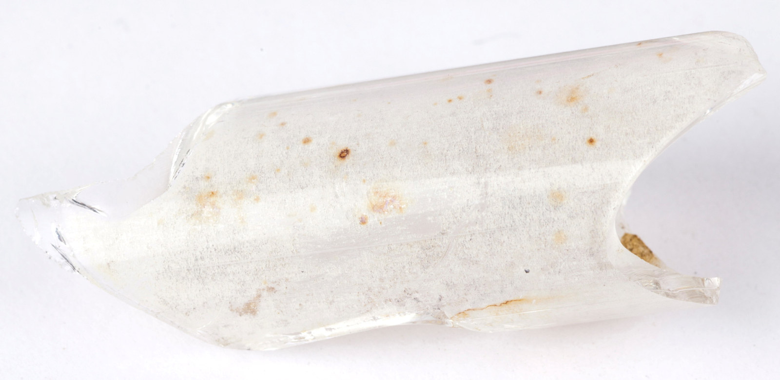Piece of glass tube with discoloured surface.