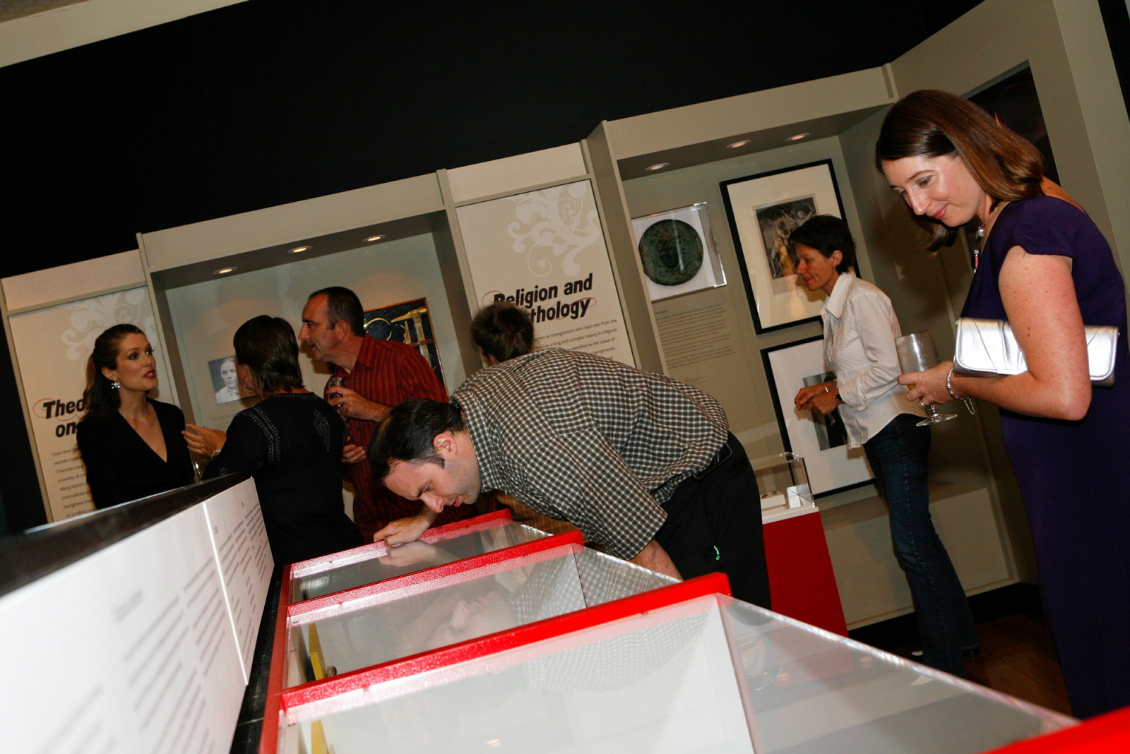 Visitors enjoy the Femme Fatale exhibition at the Justice & Police Museum