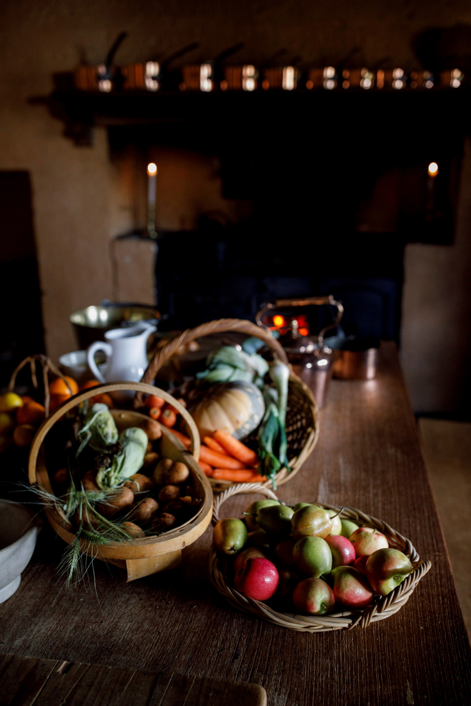 Fruit and vegetables arranged on wooden table.