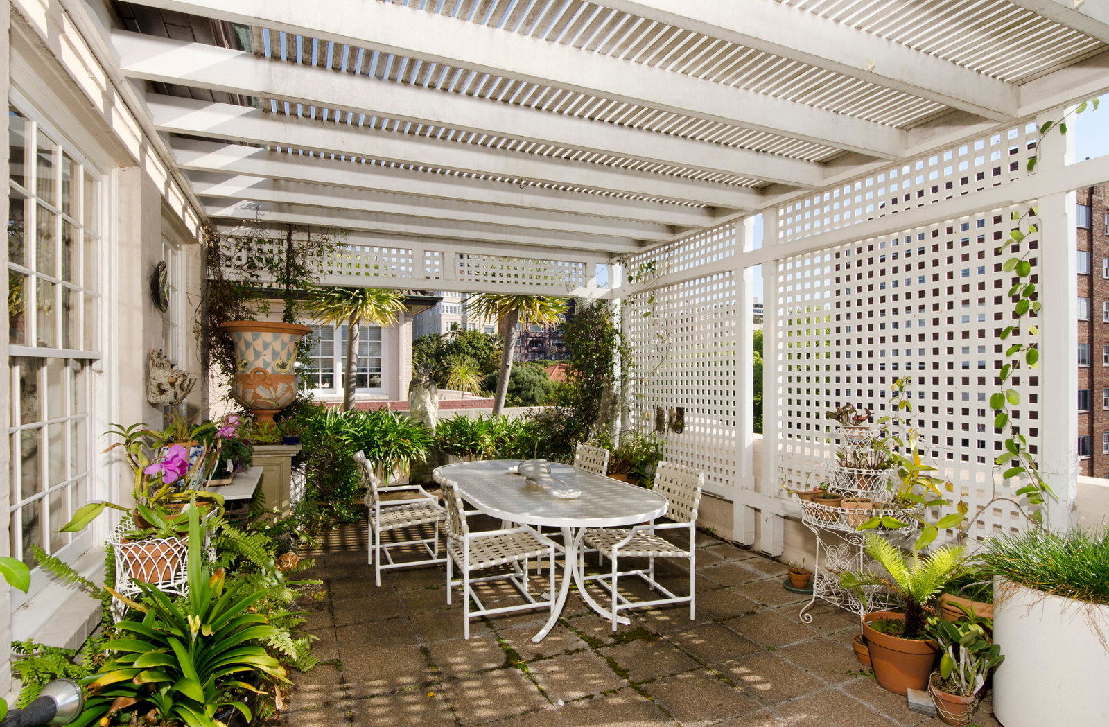 Outdoor terrace area outside the dining room at designer Leslie Walford's penthouse apartment, Double Bay