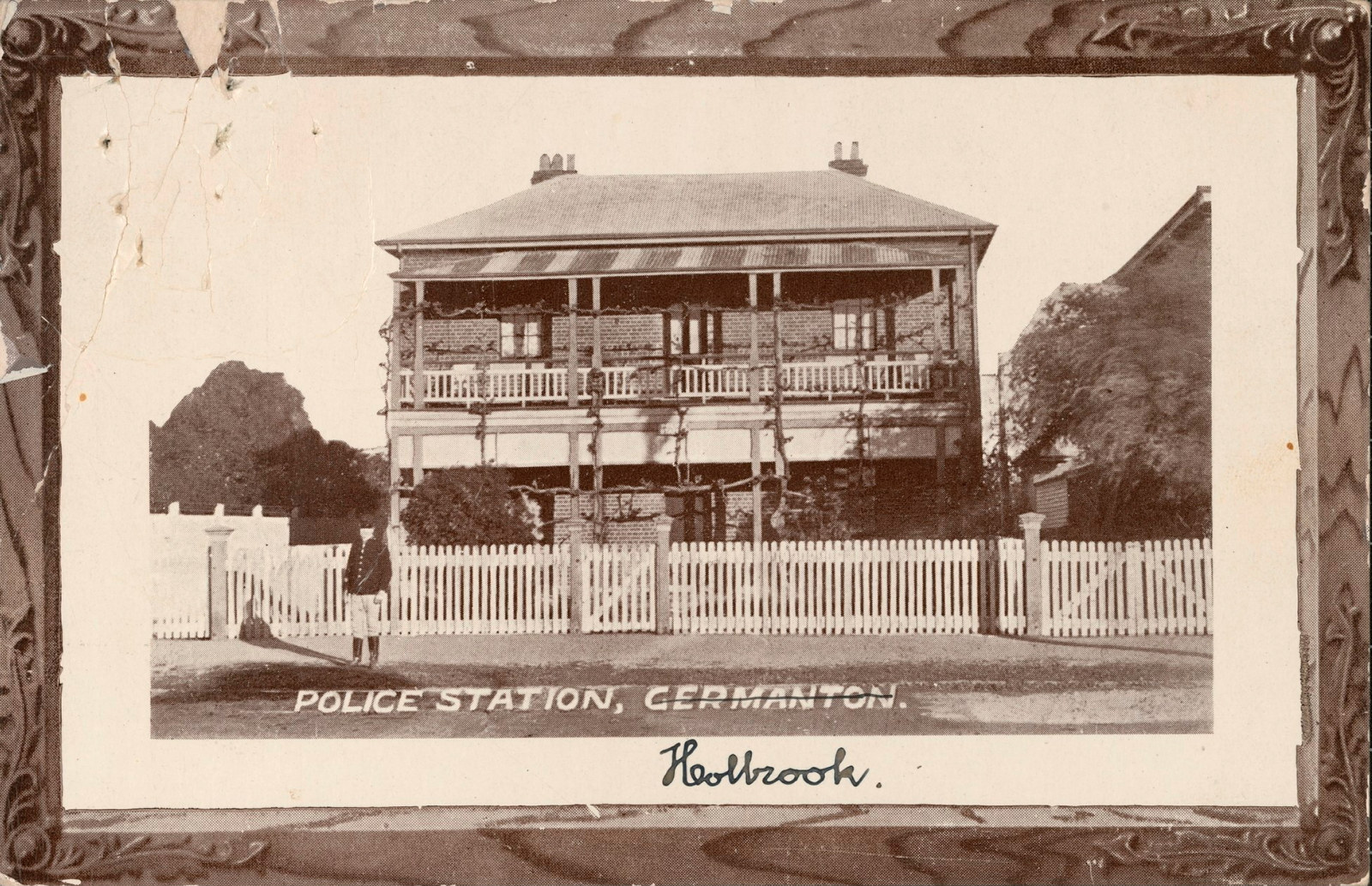 Black and white postcard depicting police station with hand written note saying Holbrook, with Germanton crossed out.