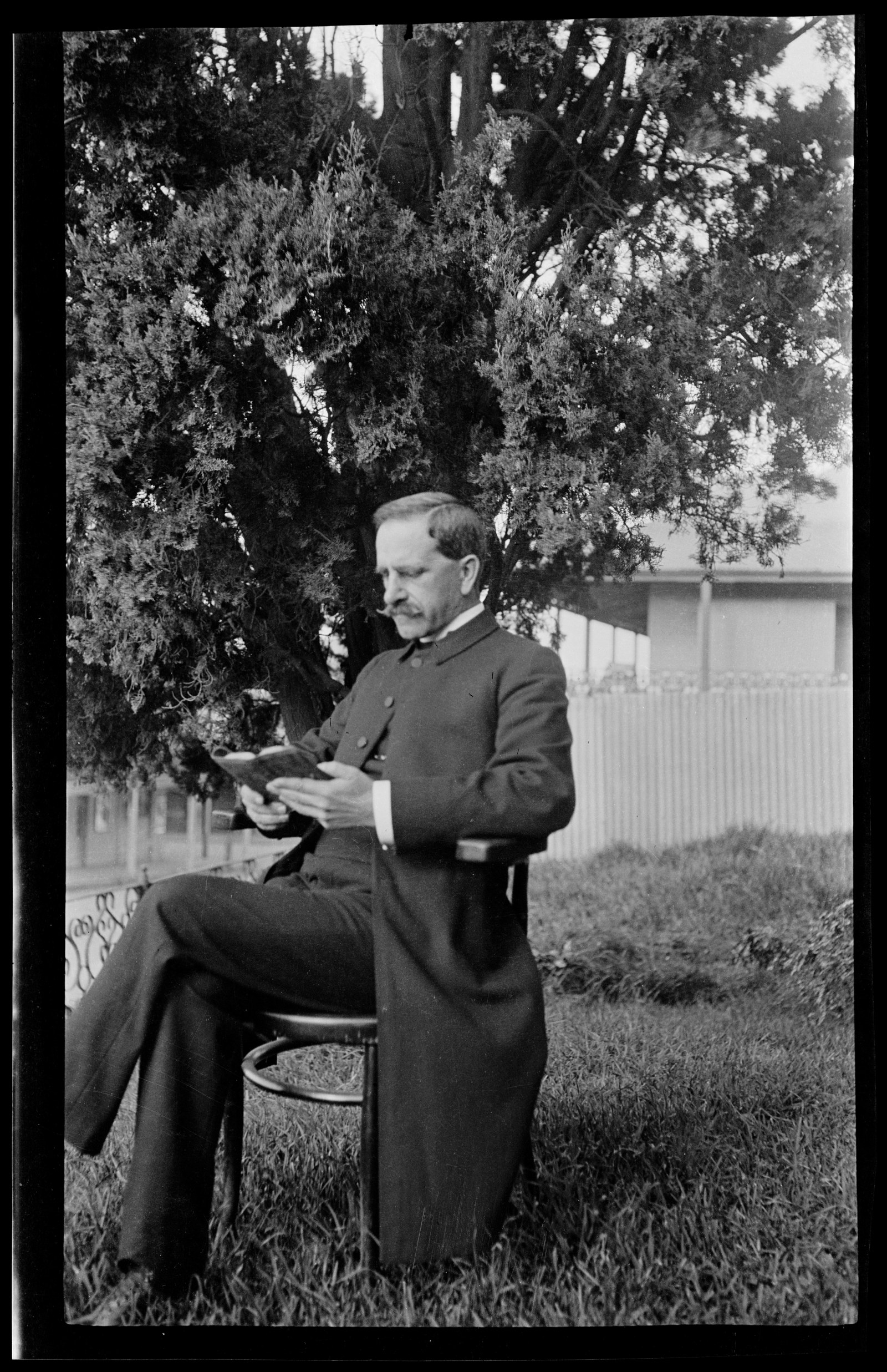 The Reverend Donald McKay Barnet in the front garden of the Presbyterian Manse, Wollongong, photograph taken by Robert Barnet, 1916