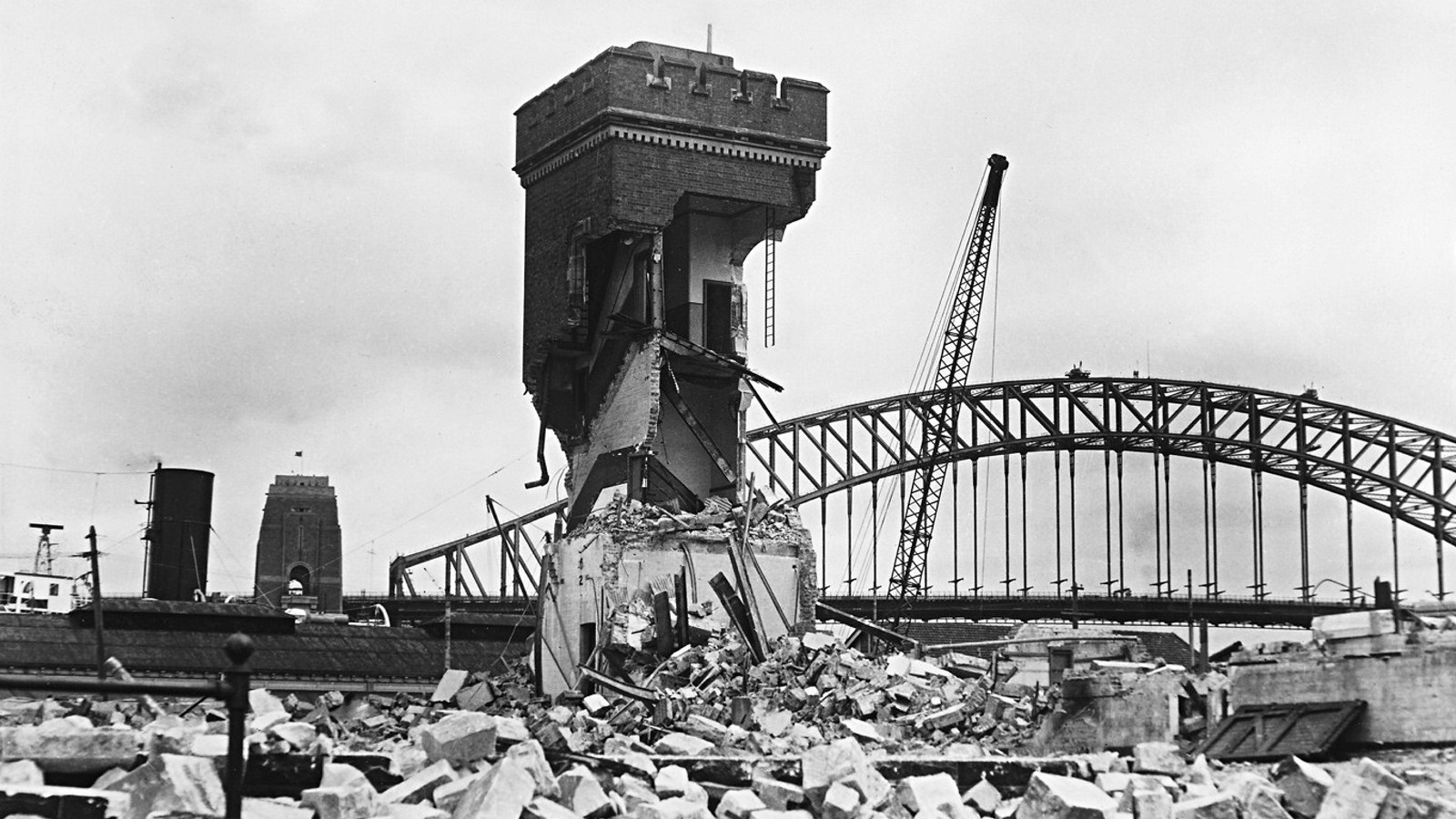 Demolished building in foreground, Harbour Bridge in background.