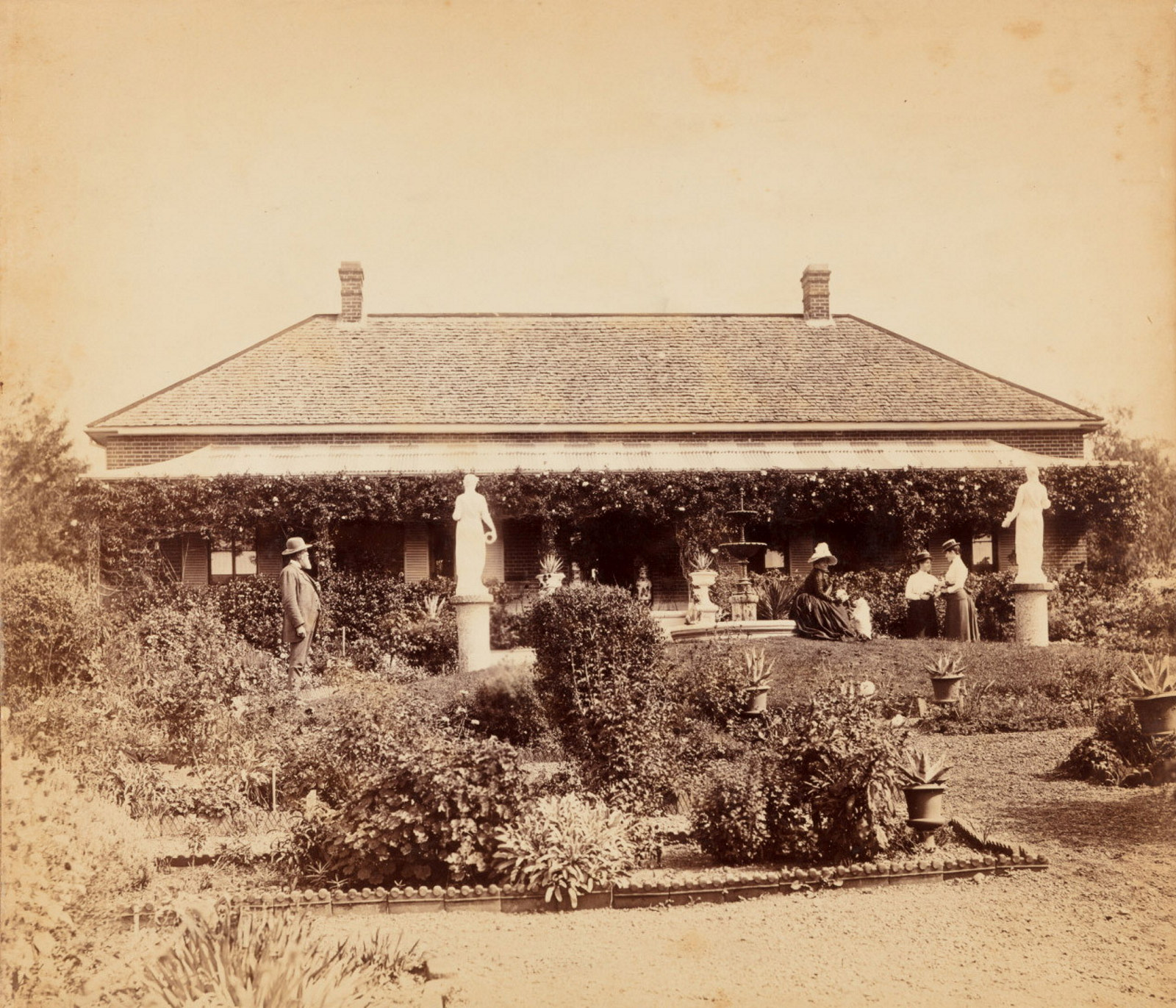 Cook family in the garden in front of Turanville near Scone / photograpjed by Joseph Check, 1889.