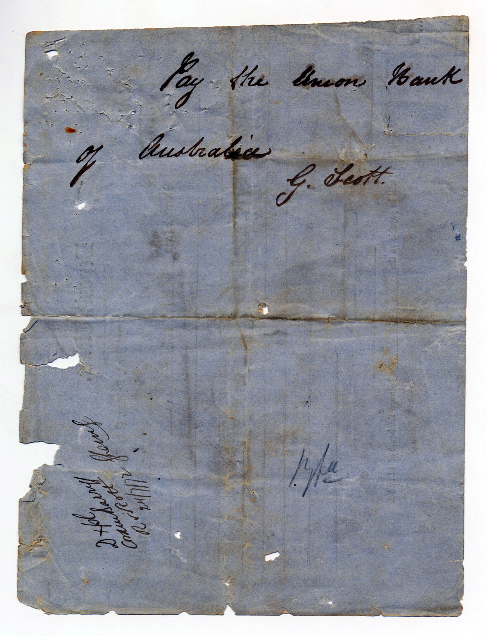 Back of worn paper form with handwritten note.
