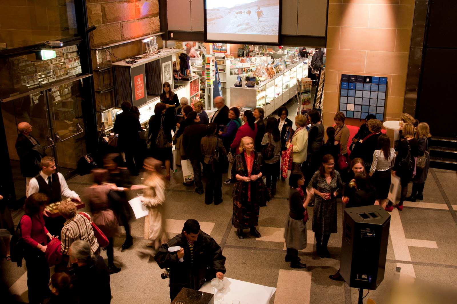 High angle view of Musem of Sydney reception area with guests and MOS Shop