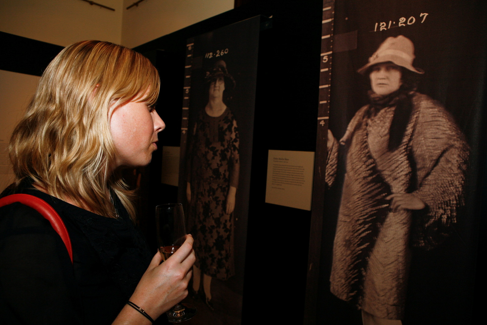 A visitor enjoys the Femme Fatale exhibition at the Justice & Police Museum