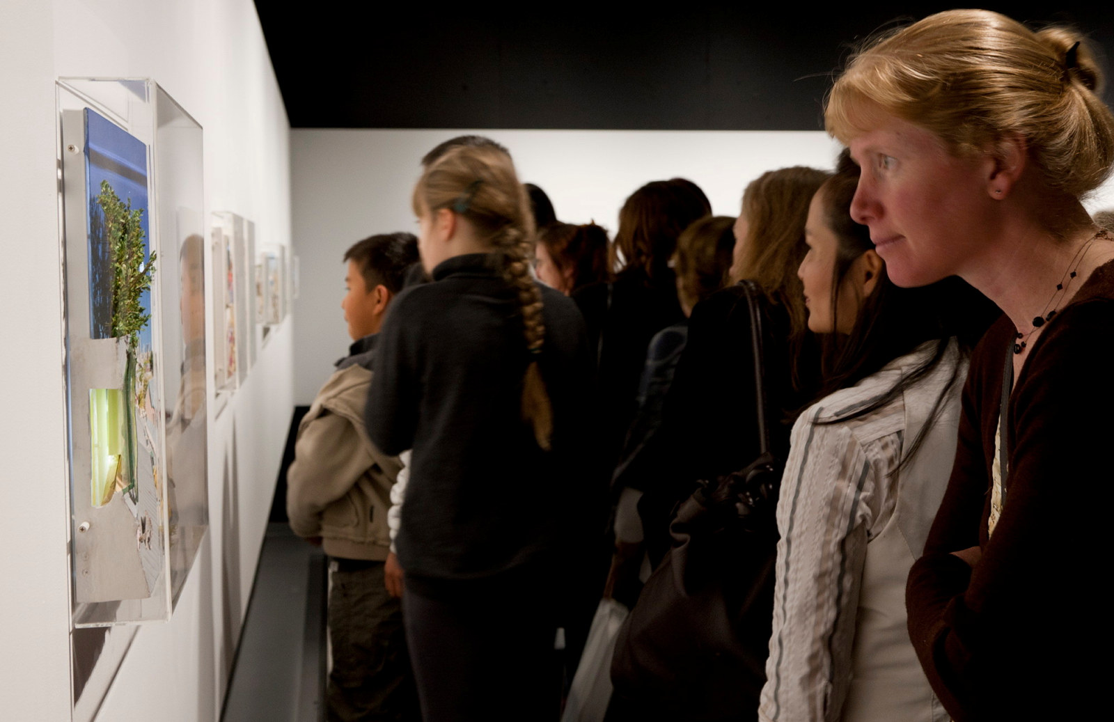 Guests viewing artwork in exhibition space