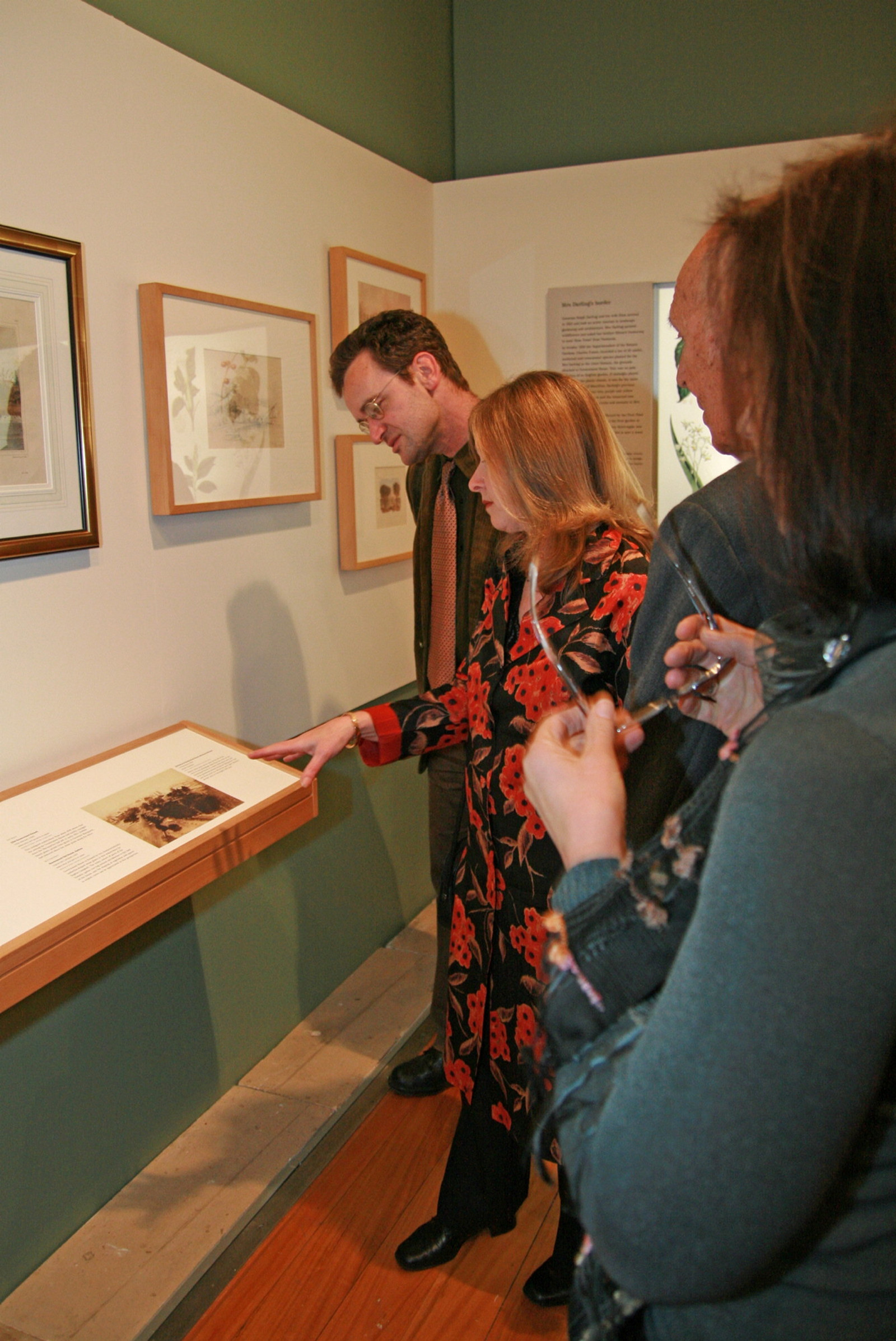 Colleen Morris shows guests through the exhibition