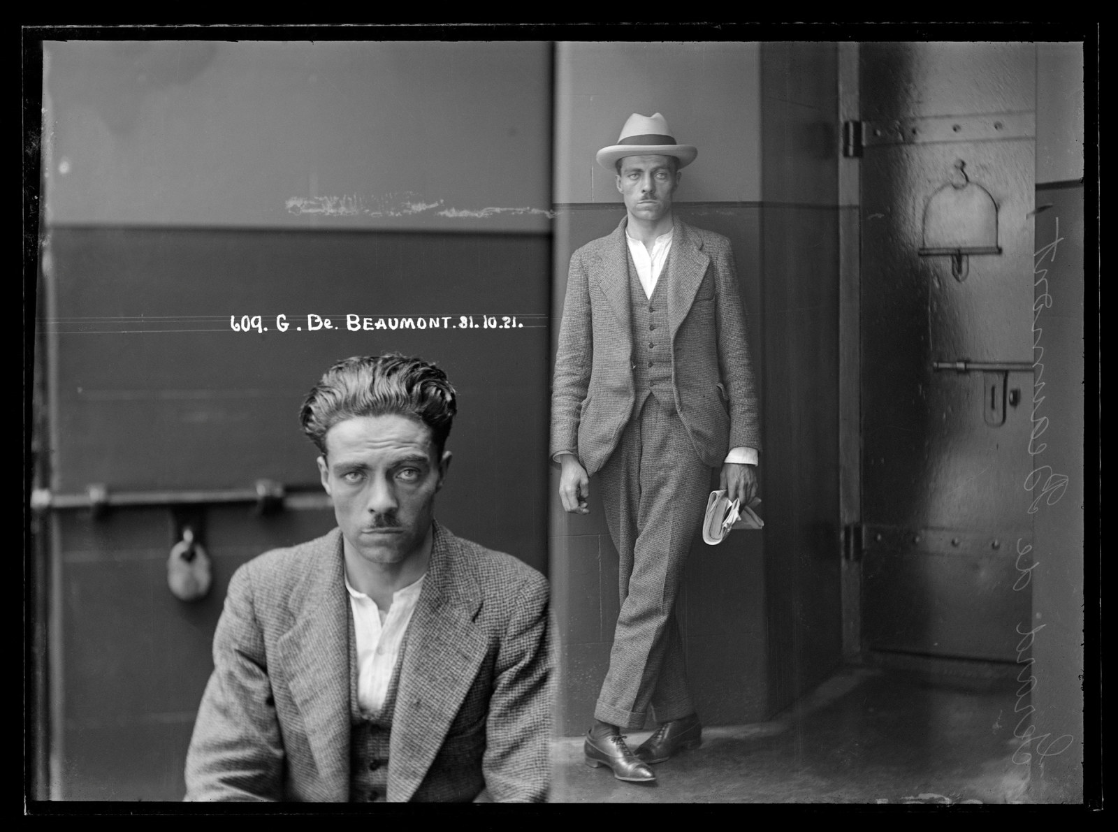 Black and white dual mugshot; man, seated on left, standing with hat on on right.
