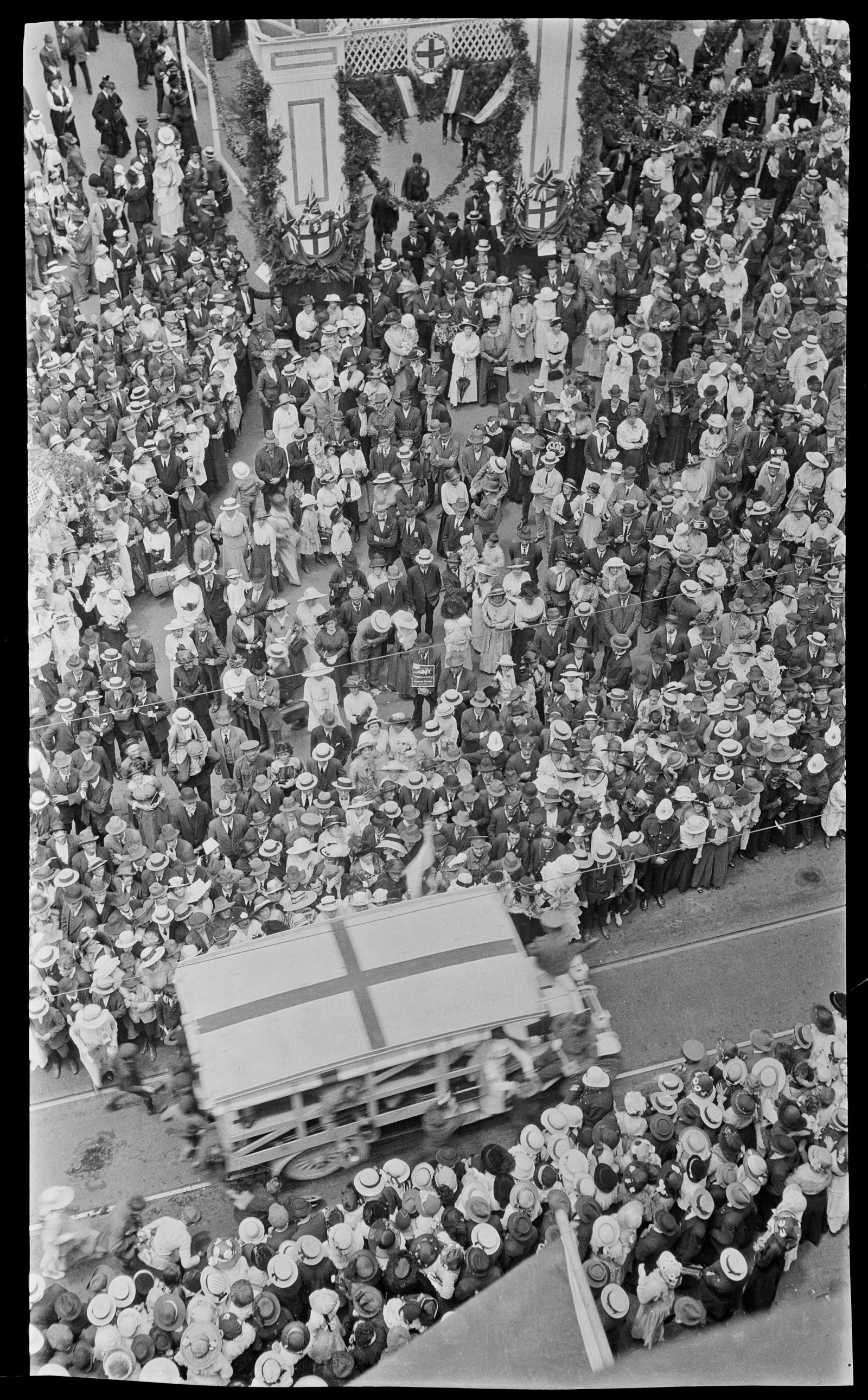 Black and white photo of large crowd from above.