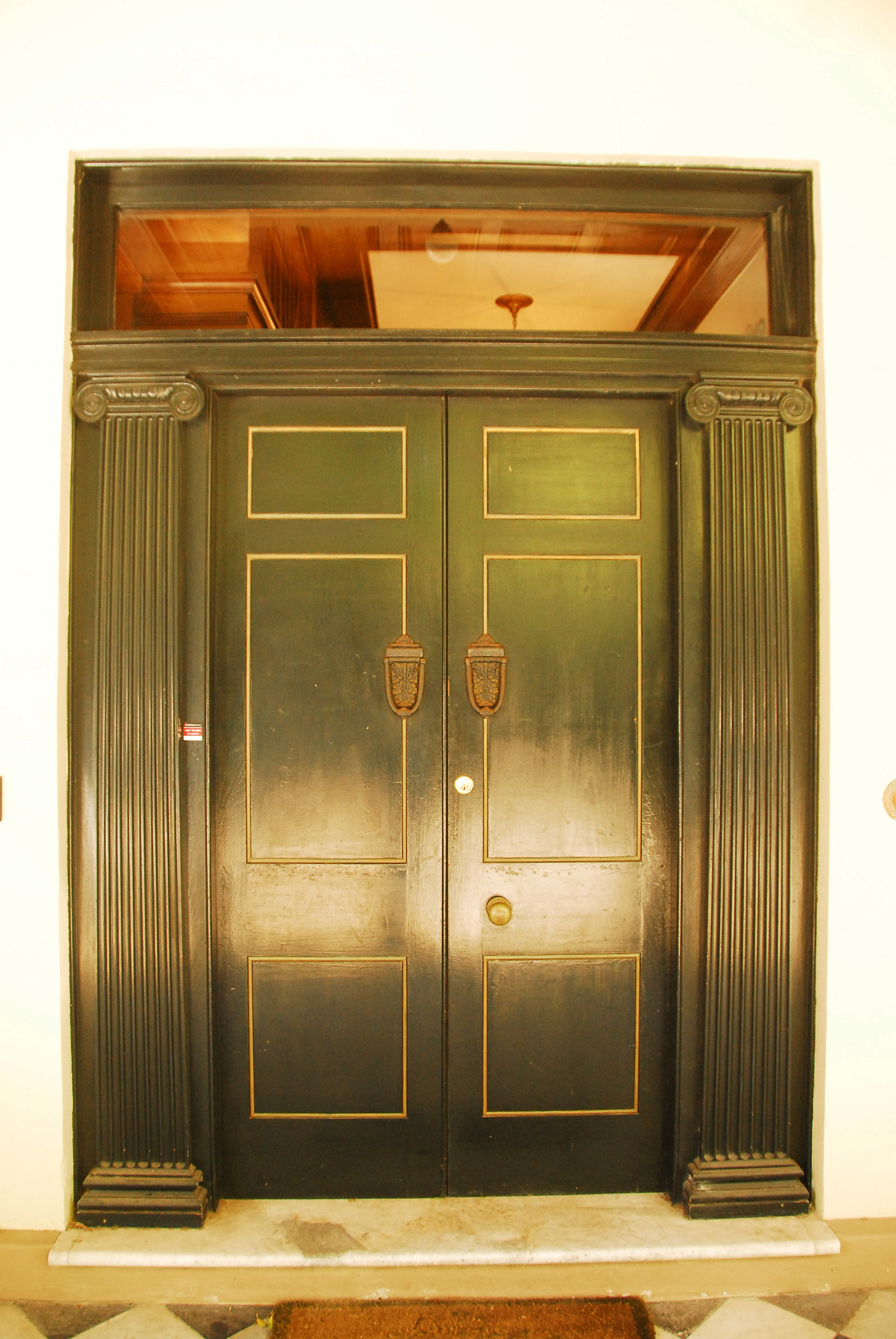 Set of painted doors with reflected light off paintwork.