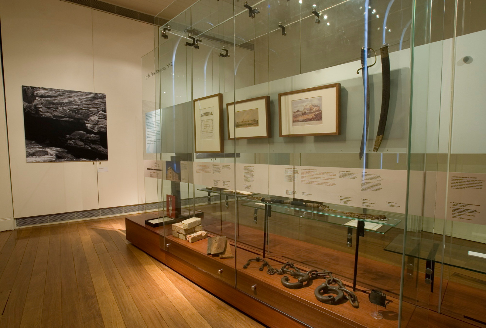 Documentation of Convicts: sites of punishment exhibition showing framed prints and multimedia
