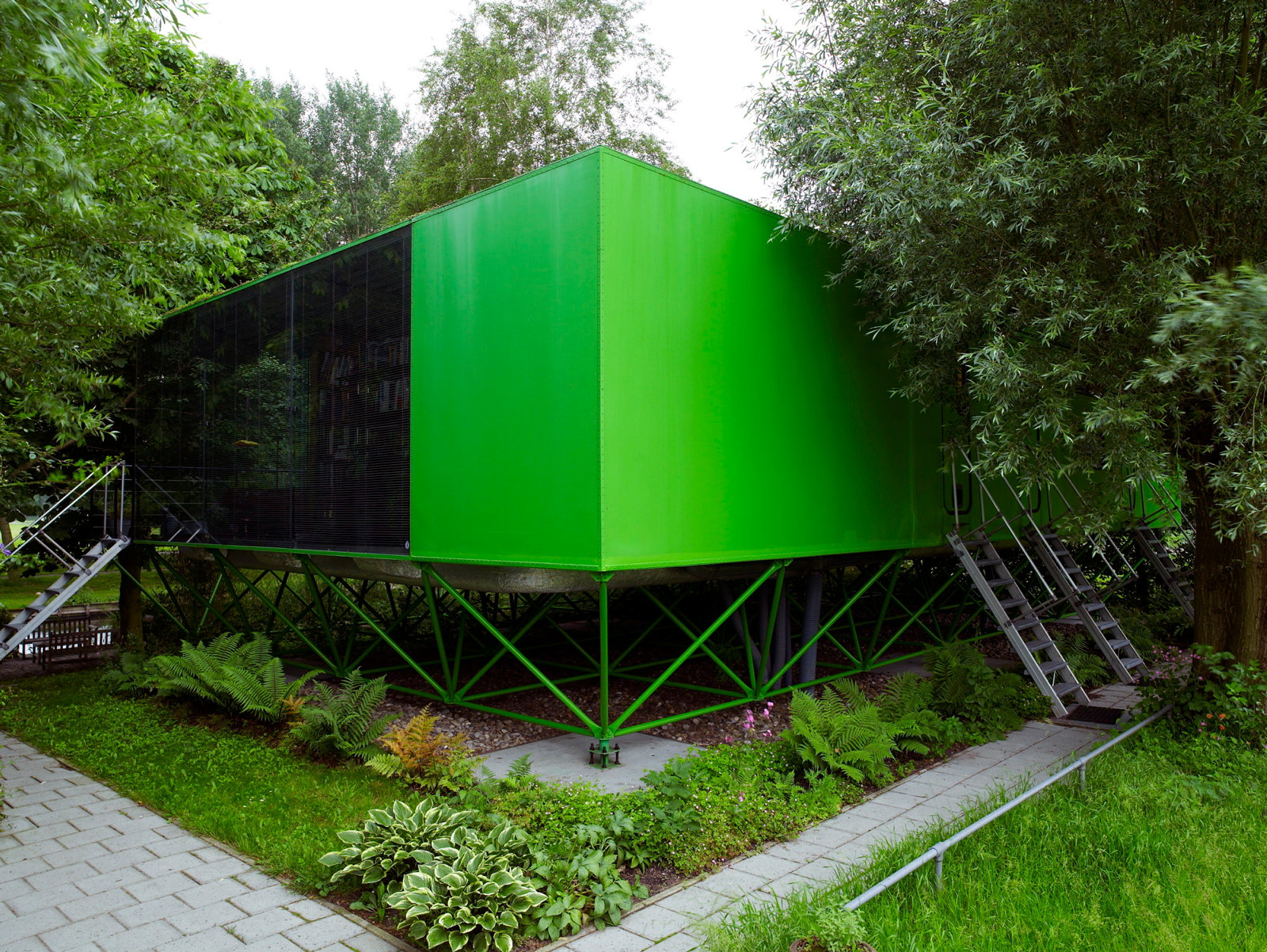 Front view of prefabricated, bright green, house in the Netherlands