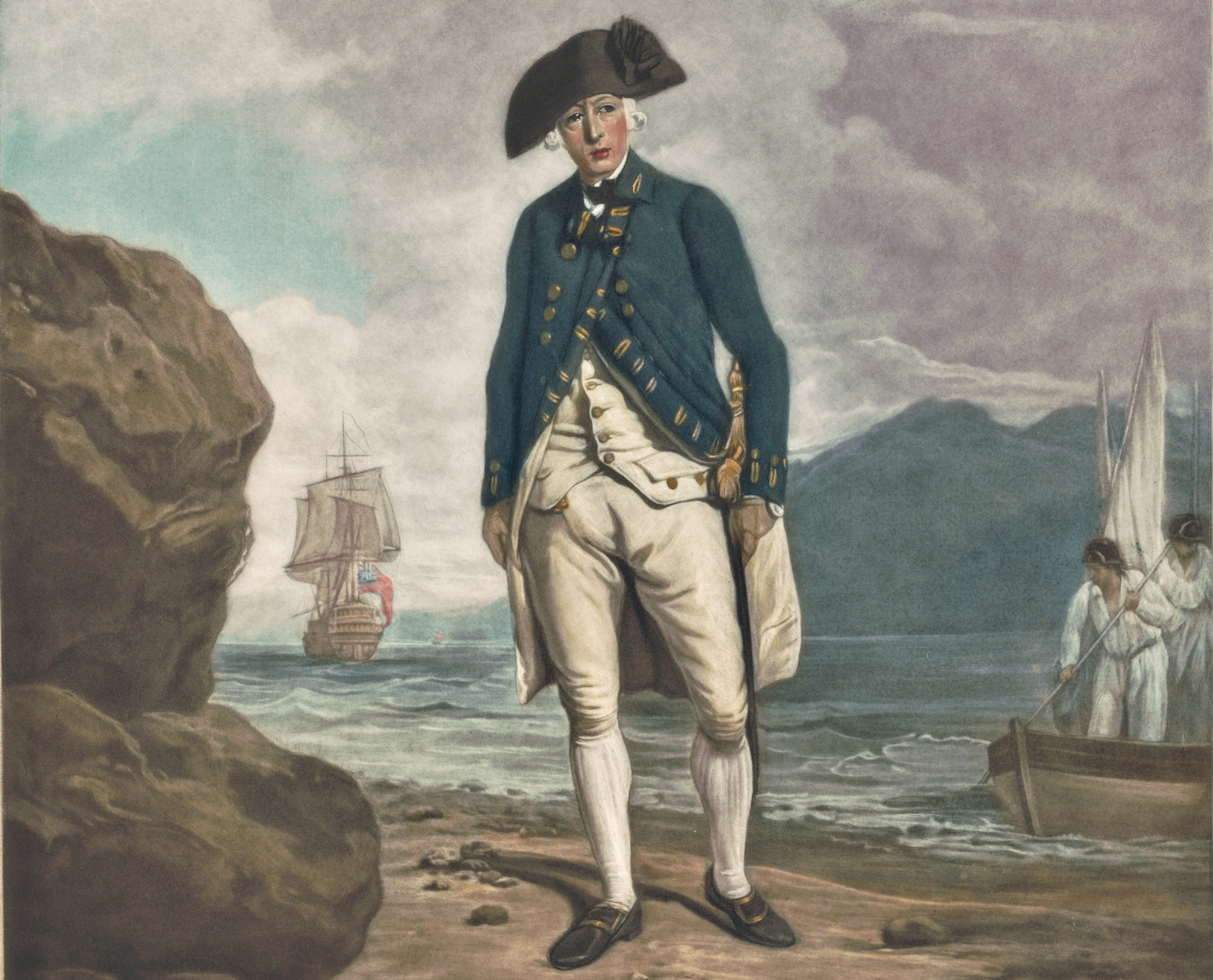 Portrait of man in uniform with black hat, standing on beach with ship and small boat in background.