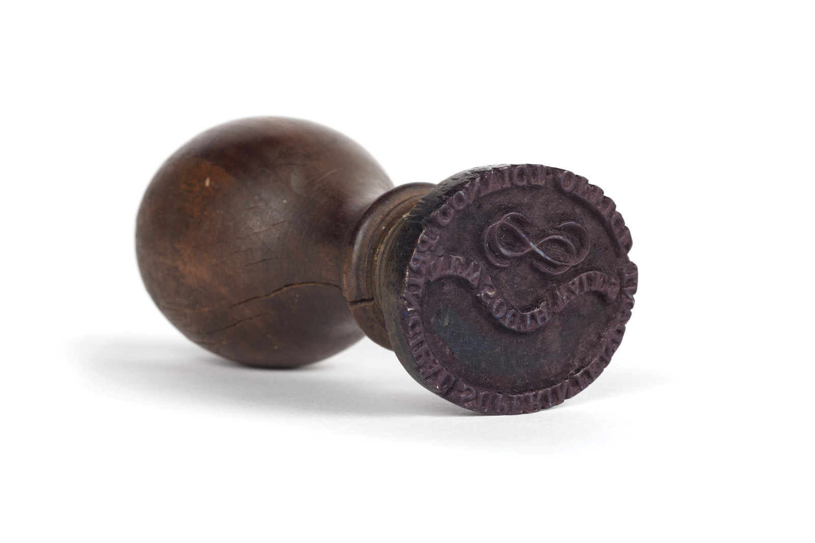 Brass dumbell shaped stamp.