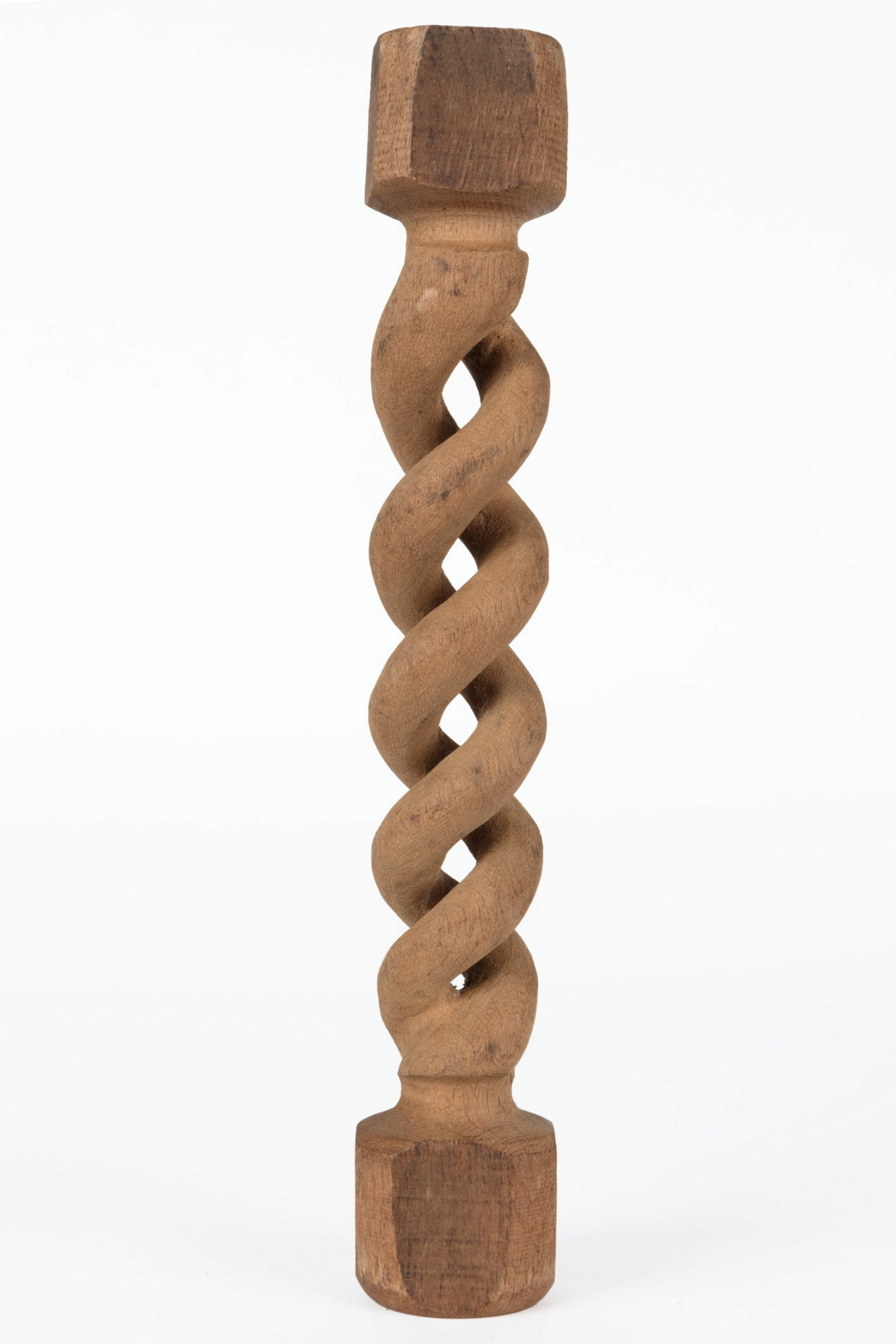A carved timber furniture leg