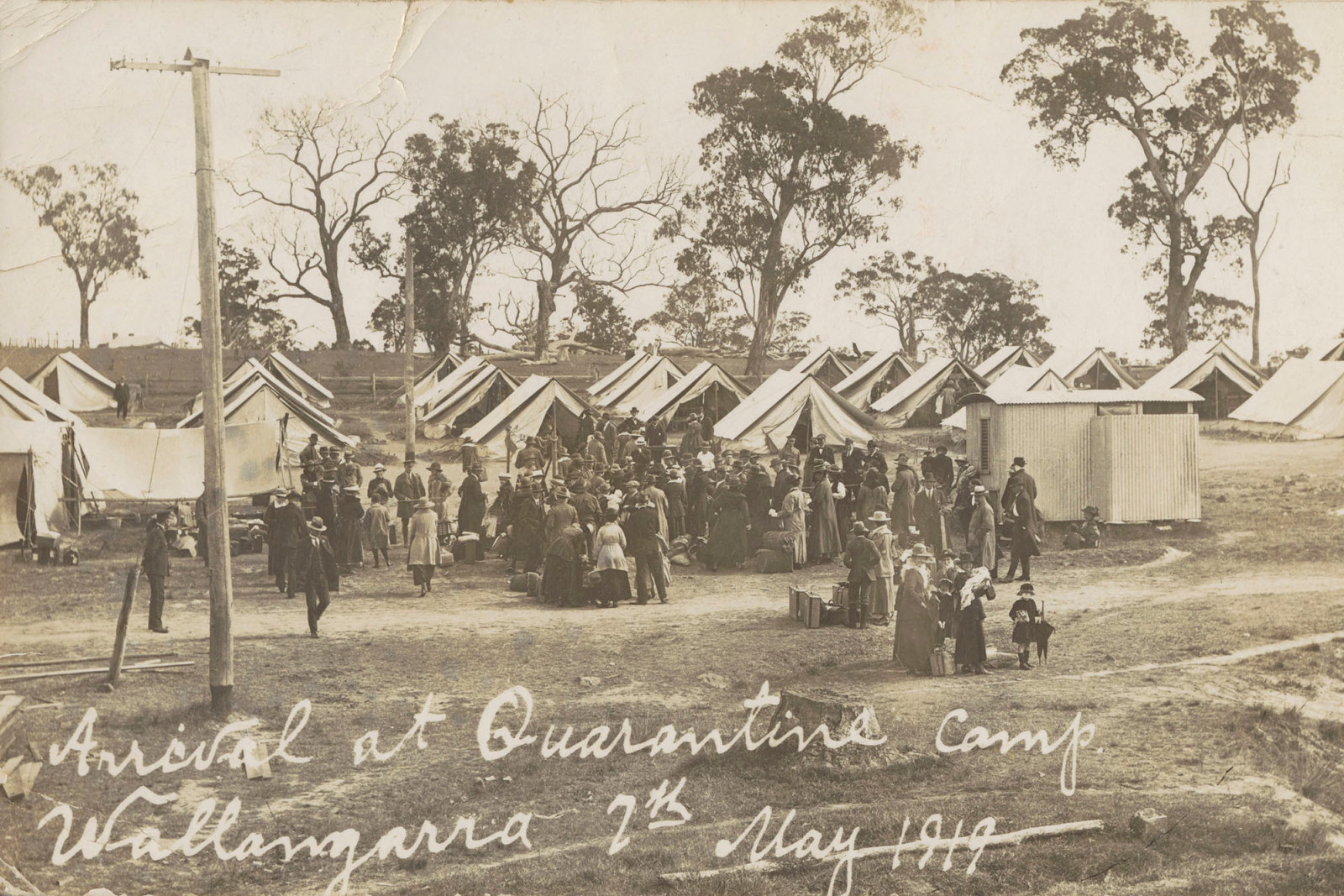 Newspaper photo of tents and people.