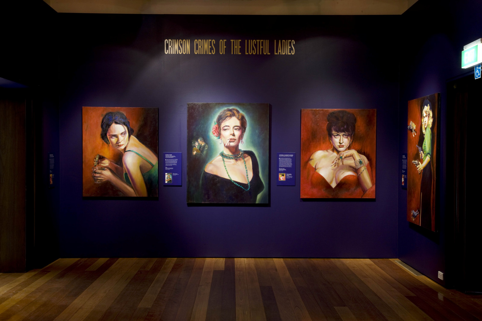 Interior of exhibition space showing colourful paintings of women on dark purple wall.