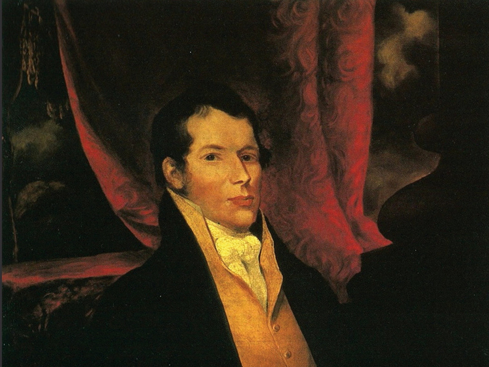 Portrait of man against dark background.