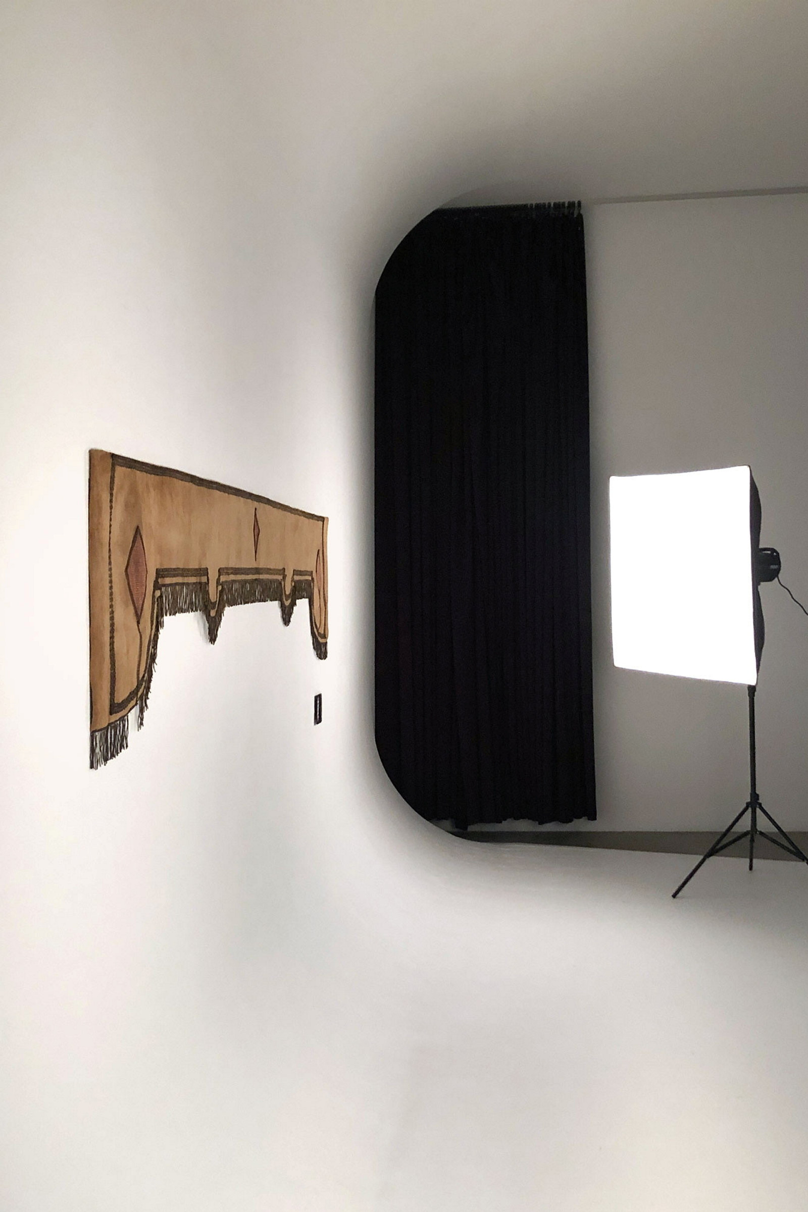 Curtain valance of beige brushed velvet being photographed in professional studio cyclorama.