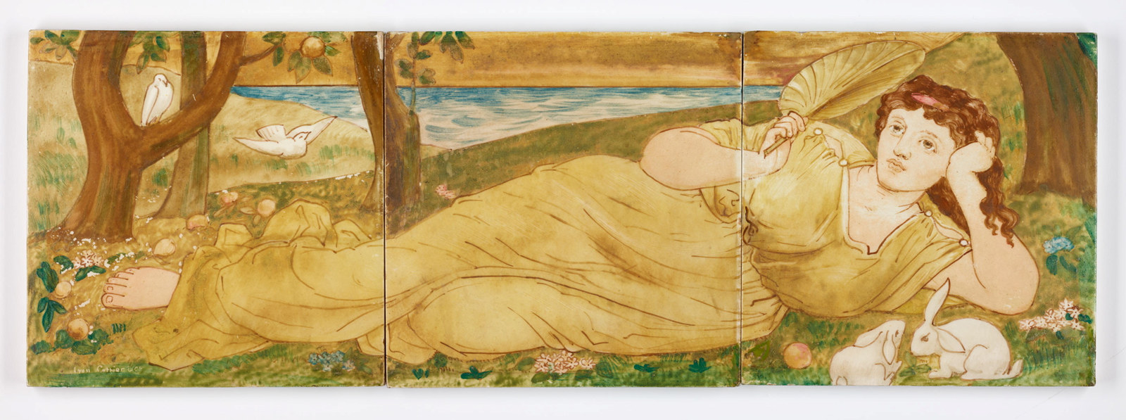 Panel of three ceramic tiles with handpainted decoration of a reclining woman