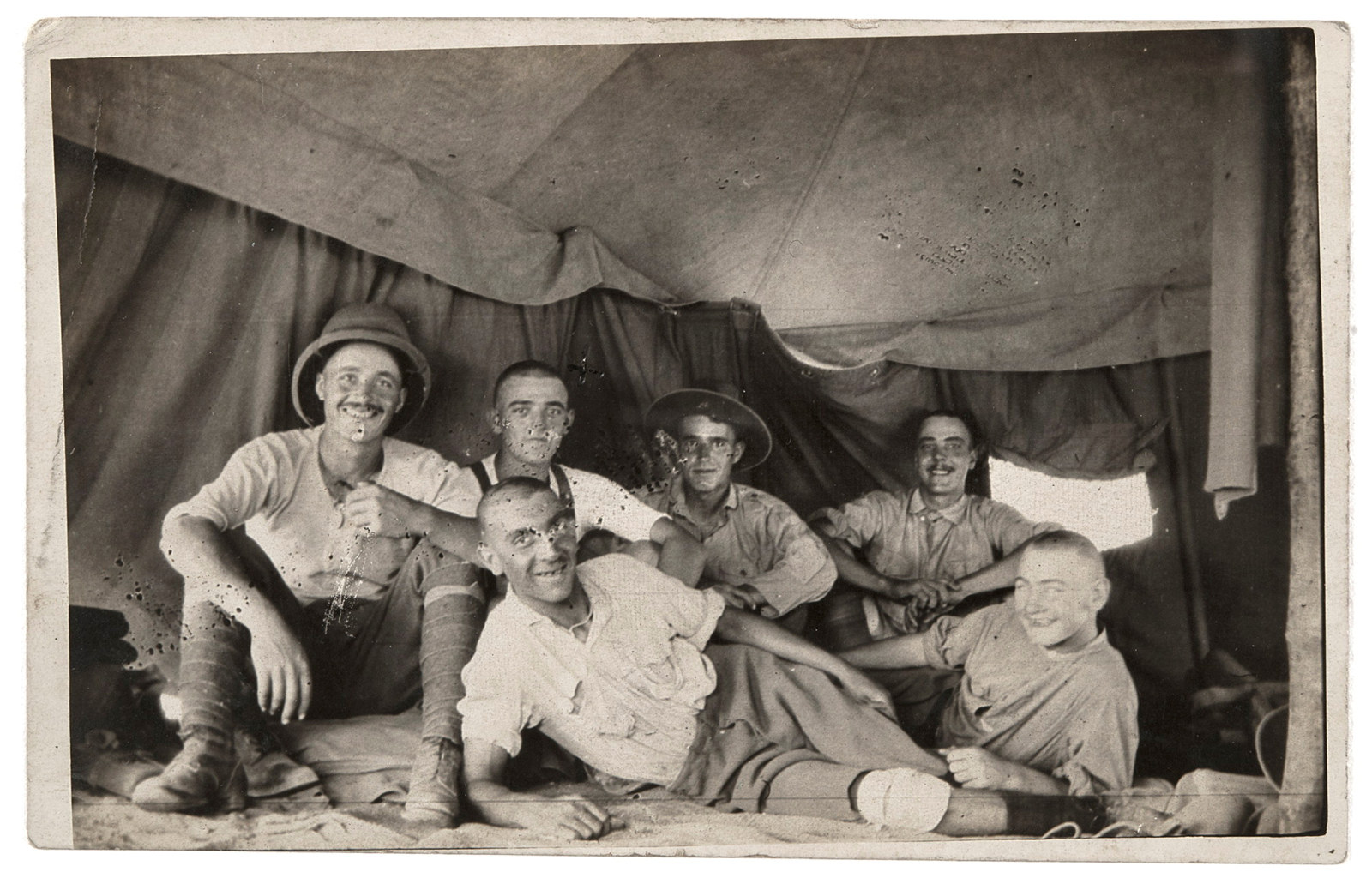 Postcard of Fred Gallagher (seated 2nd from left) with five other soldiers,  from an album compiled by Mary (Girlie) Andersen, 1915