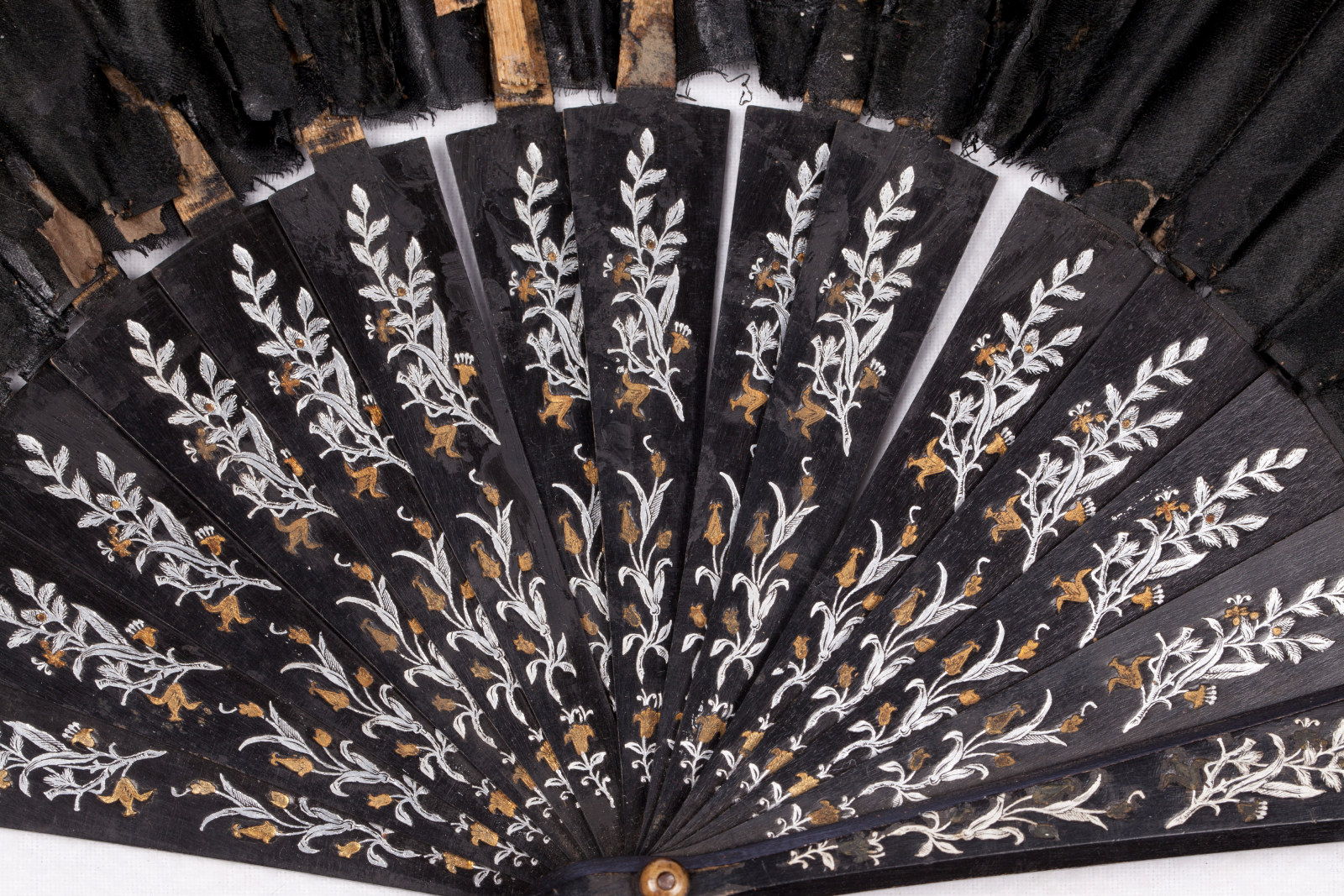 Black silk taffeta fan decorated with floral design, 1870-1890