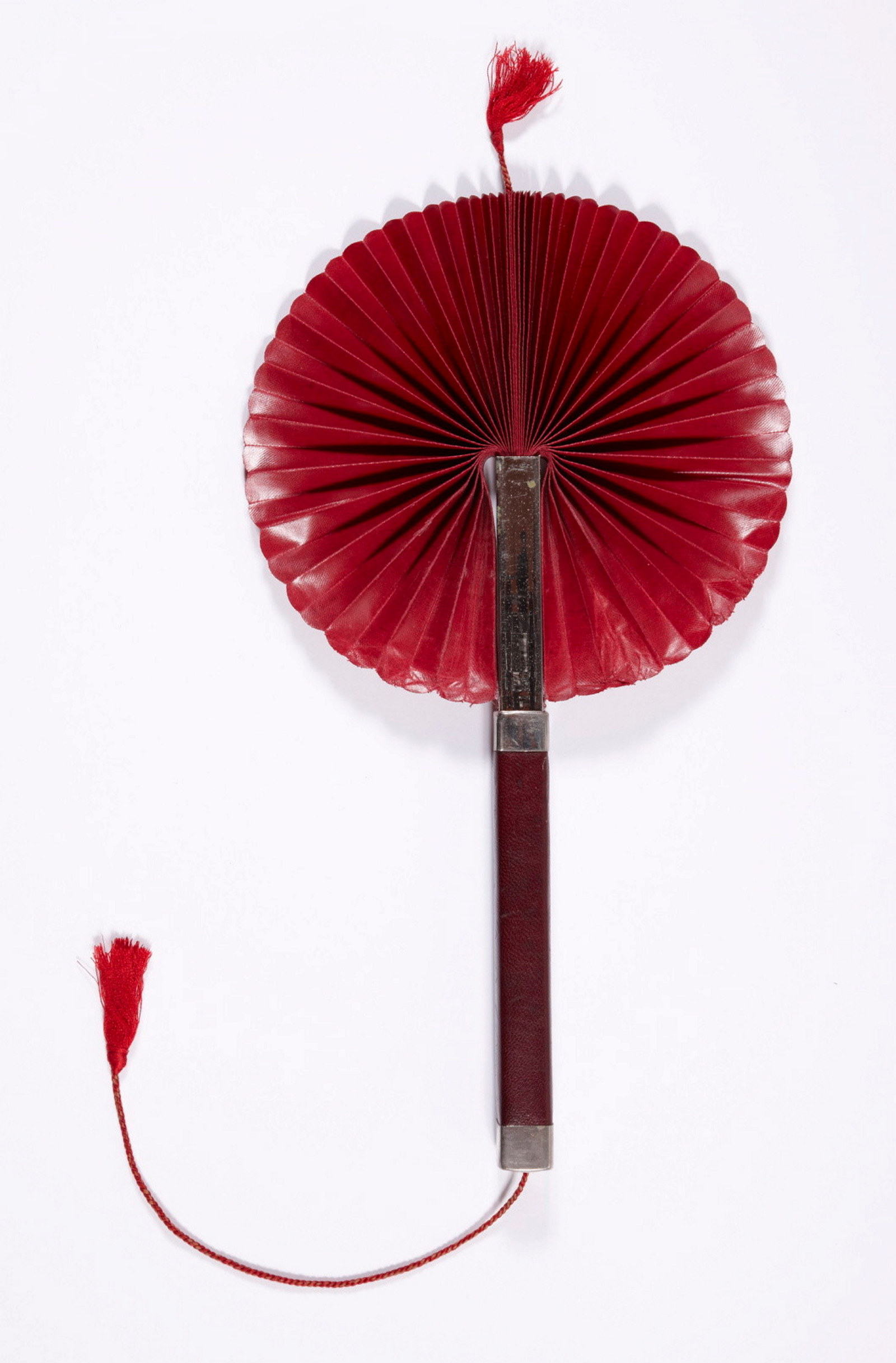 Cockade fan. Wood with leatherette and fabric. Likely Chinese, early 1900s.