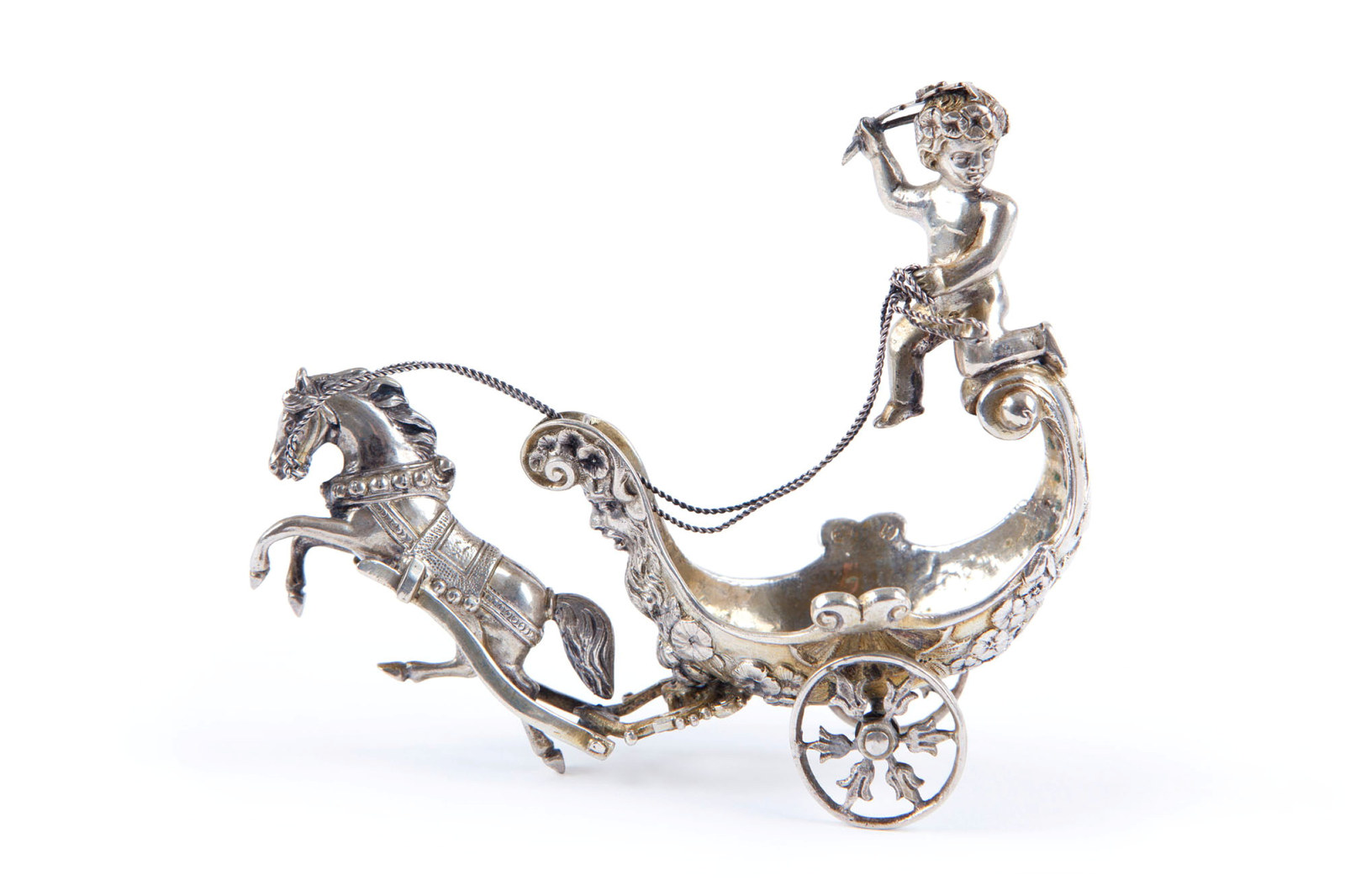 Silver stylised horse drawing a chariot.