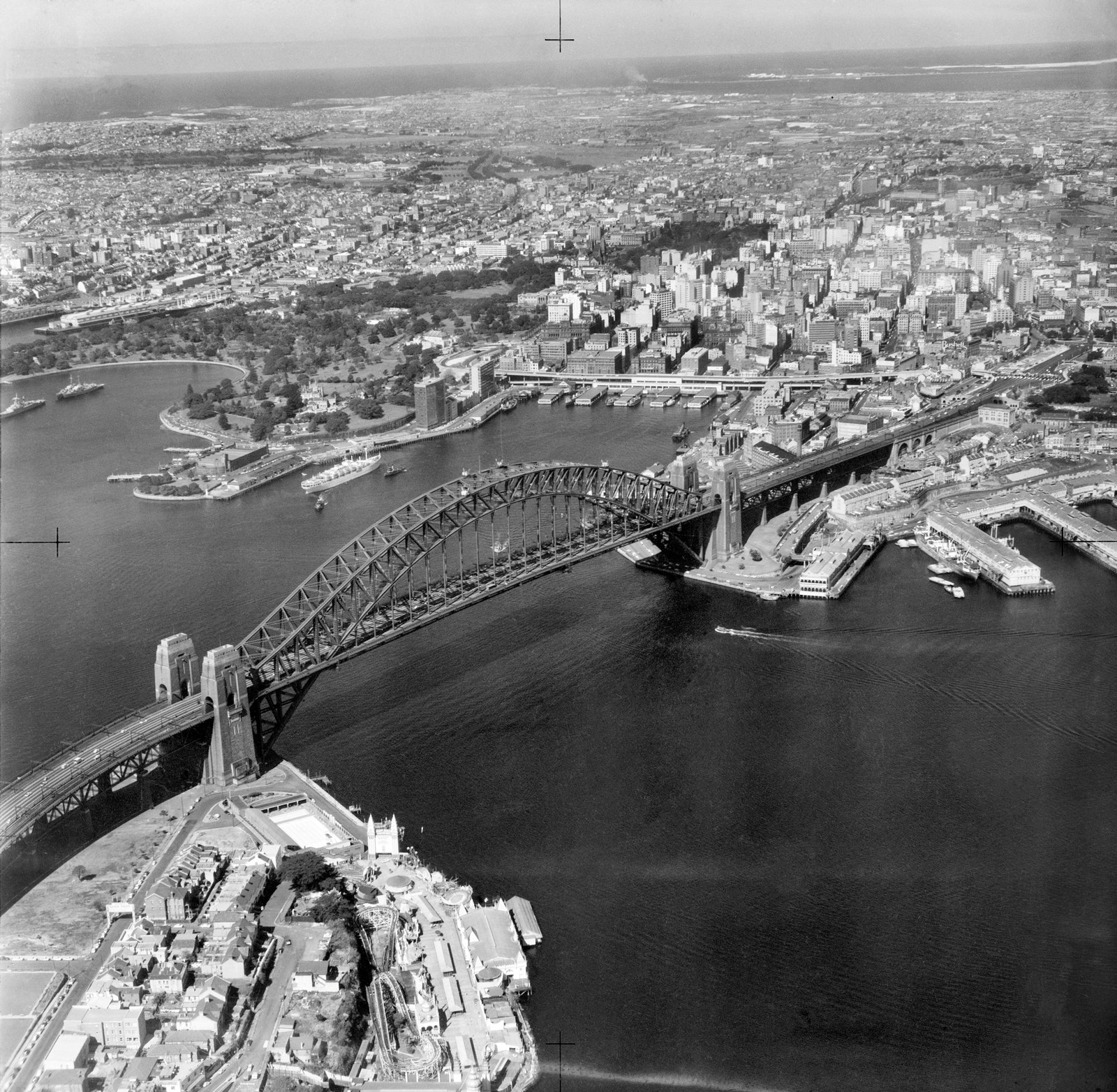 Aerial view of Sydney looking over the Harbour Bridge to Circular Quay. Photographer unknown, 1958. NATIONAL ARCHIVES OF AUSTRALIA:A1200, L27972