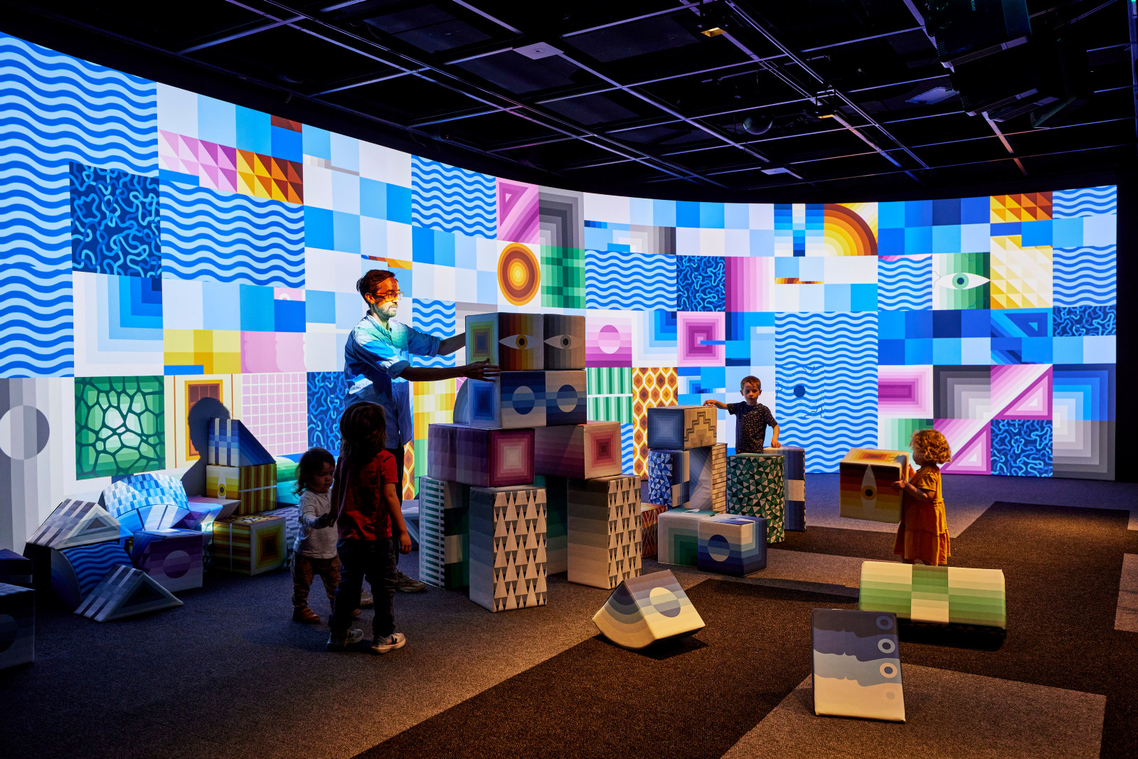 Visitors building structures at PlayScapes at the Museum of Sydney