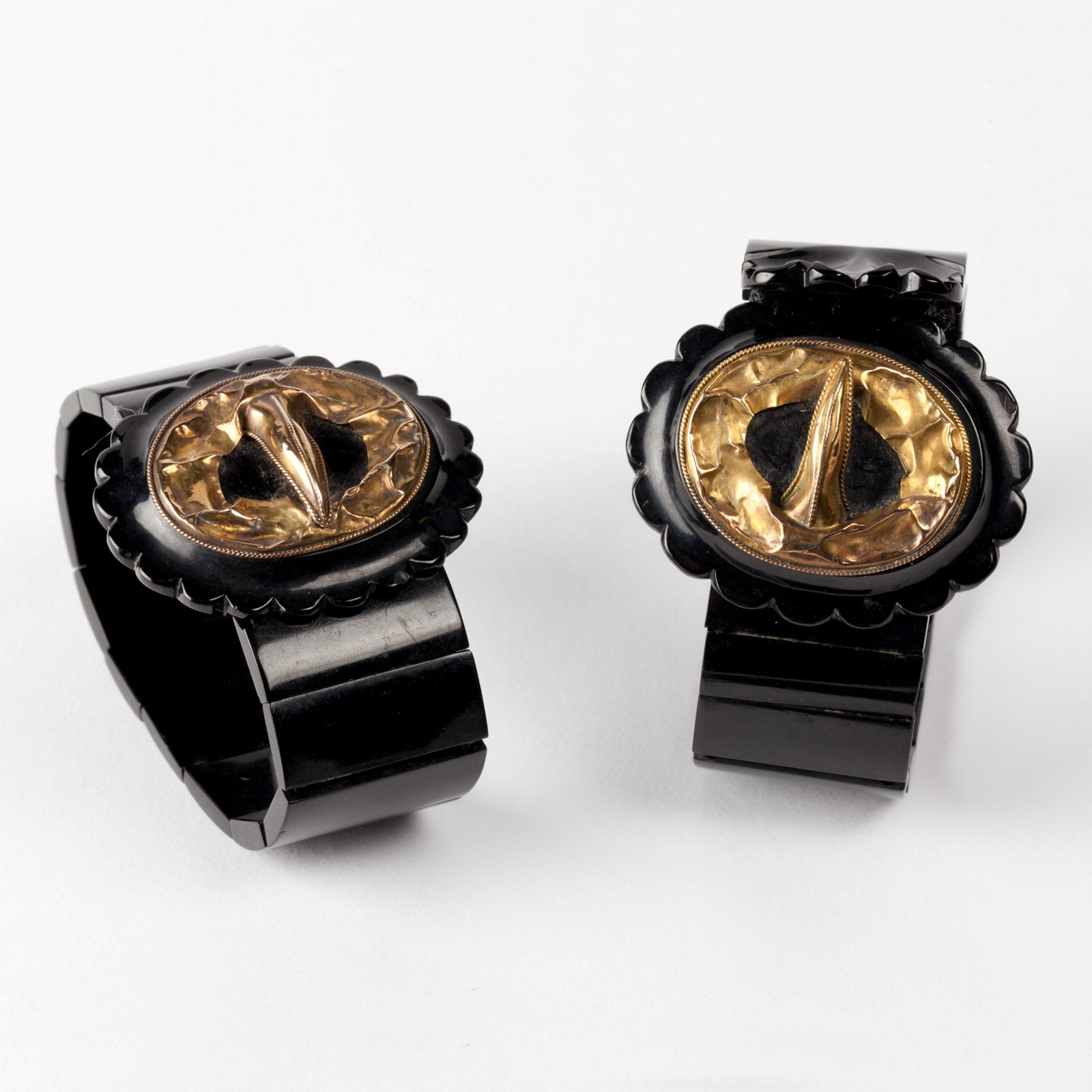 Pair of Whitby jet strap and buckle style bracelets, 1860s