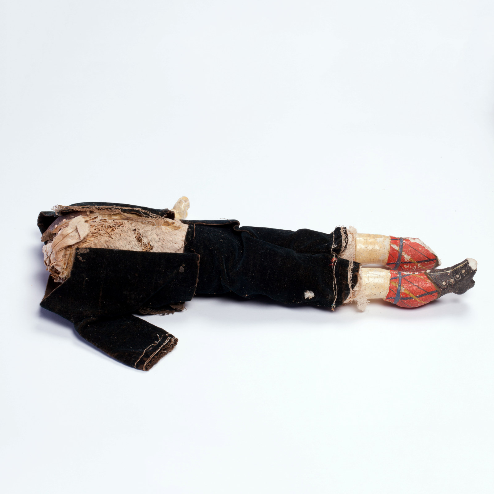 Male doll with his head, left arm and right foot missing, circa 1880