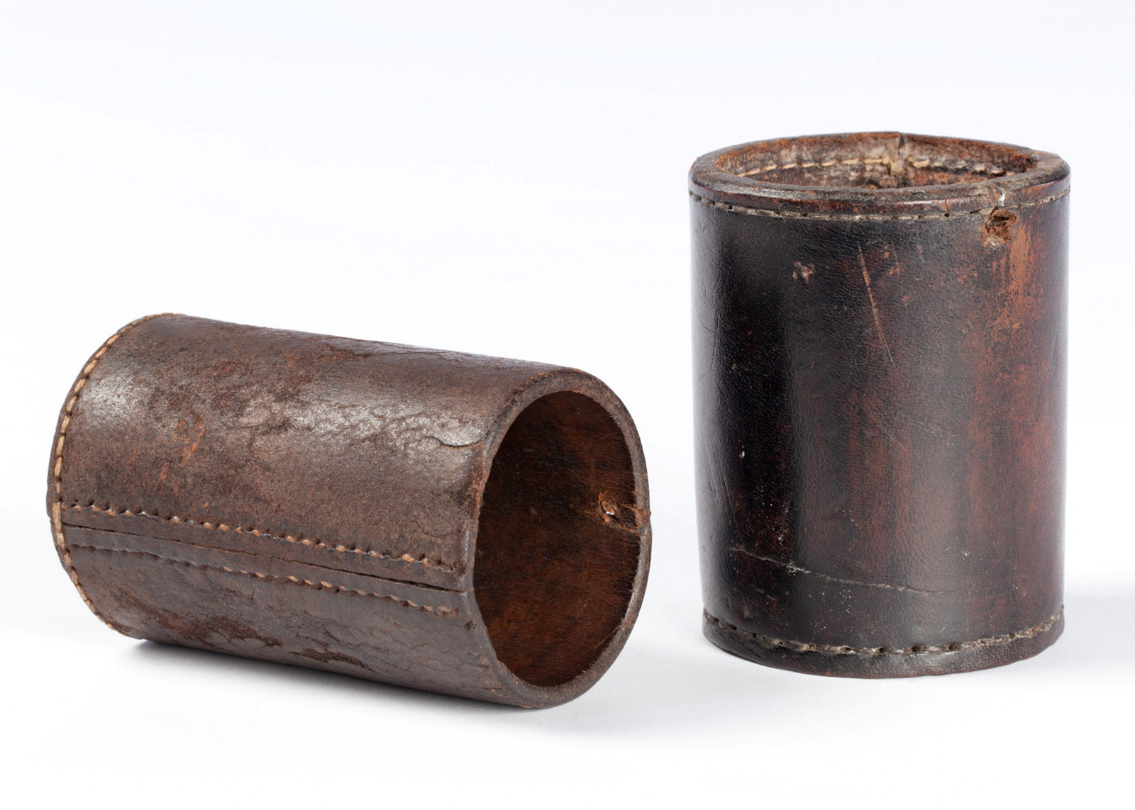 Two dice shakers made of stitched leather, circa 1933