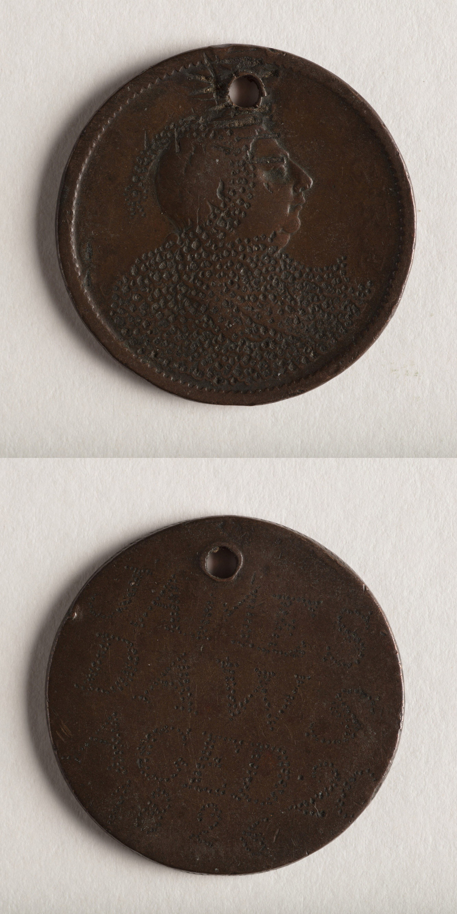Stacked images of convict love token, front and back.