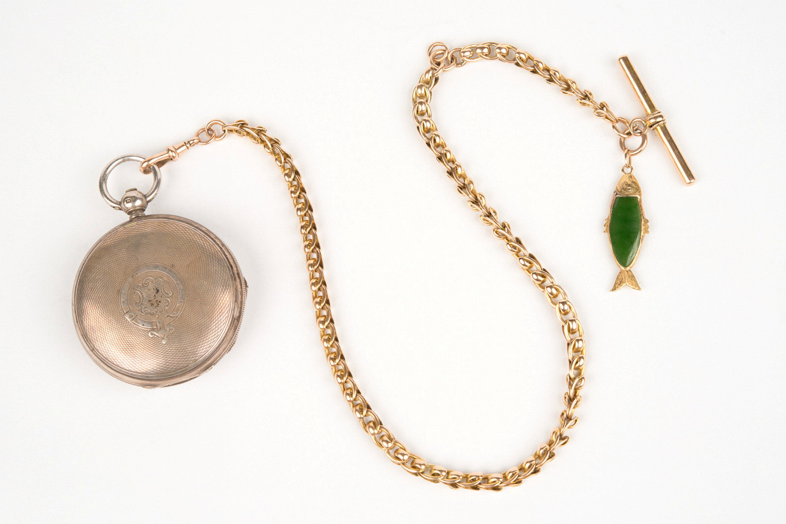 Pocket watch and watch chain with small jade fish attached, owned by Hugo Youngein who operated shop at Susannah Place