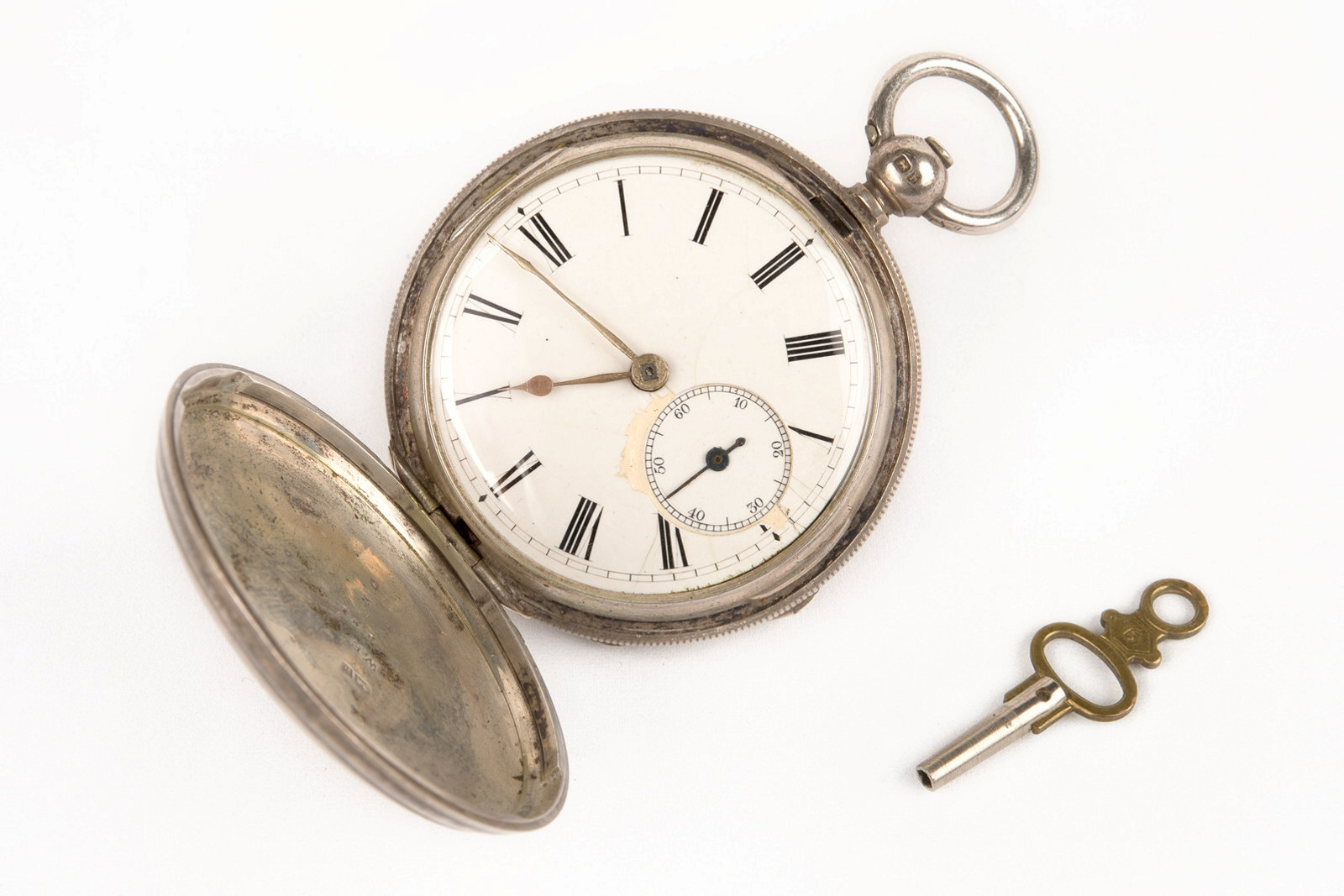 Pocket watch and winding key, circa 1863, belonging to Hugo Youngein who operated shop at Susannah Place