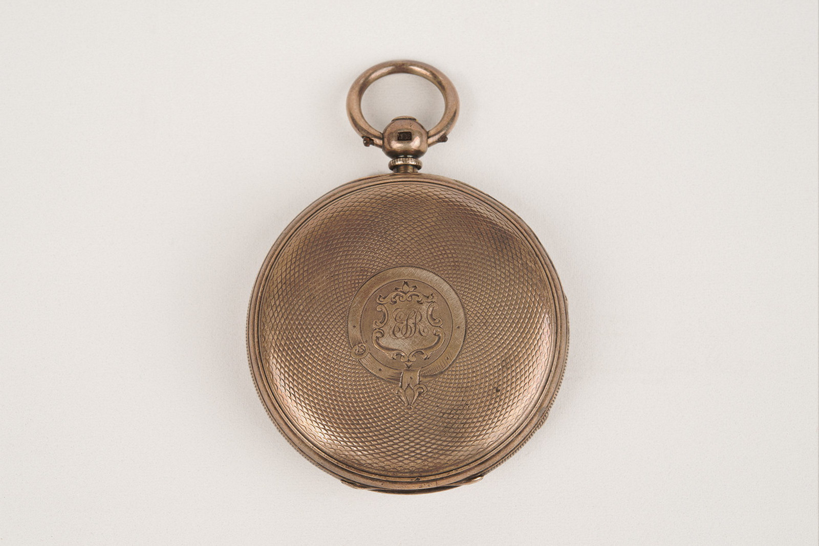 Back of an open faced silver fob watch owned by Edwin Stephen Rouse