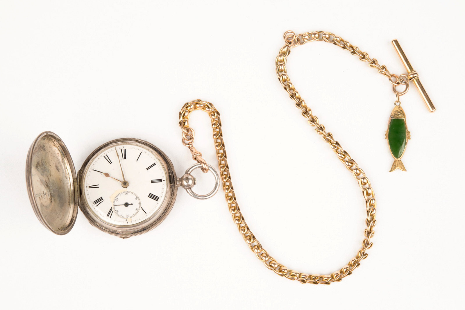 Pocket watch and watch chain with small jade fish attached, owned by Hugo Youngein who operated shop at Susannah Place