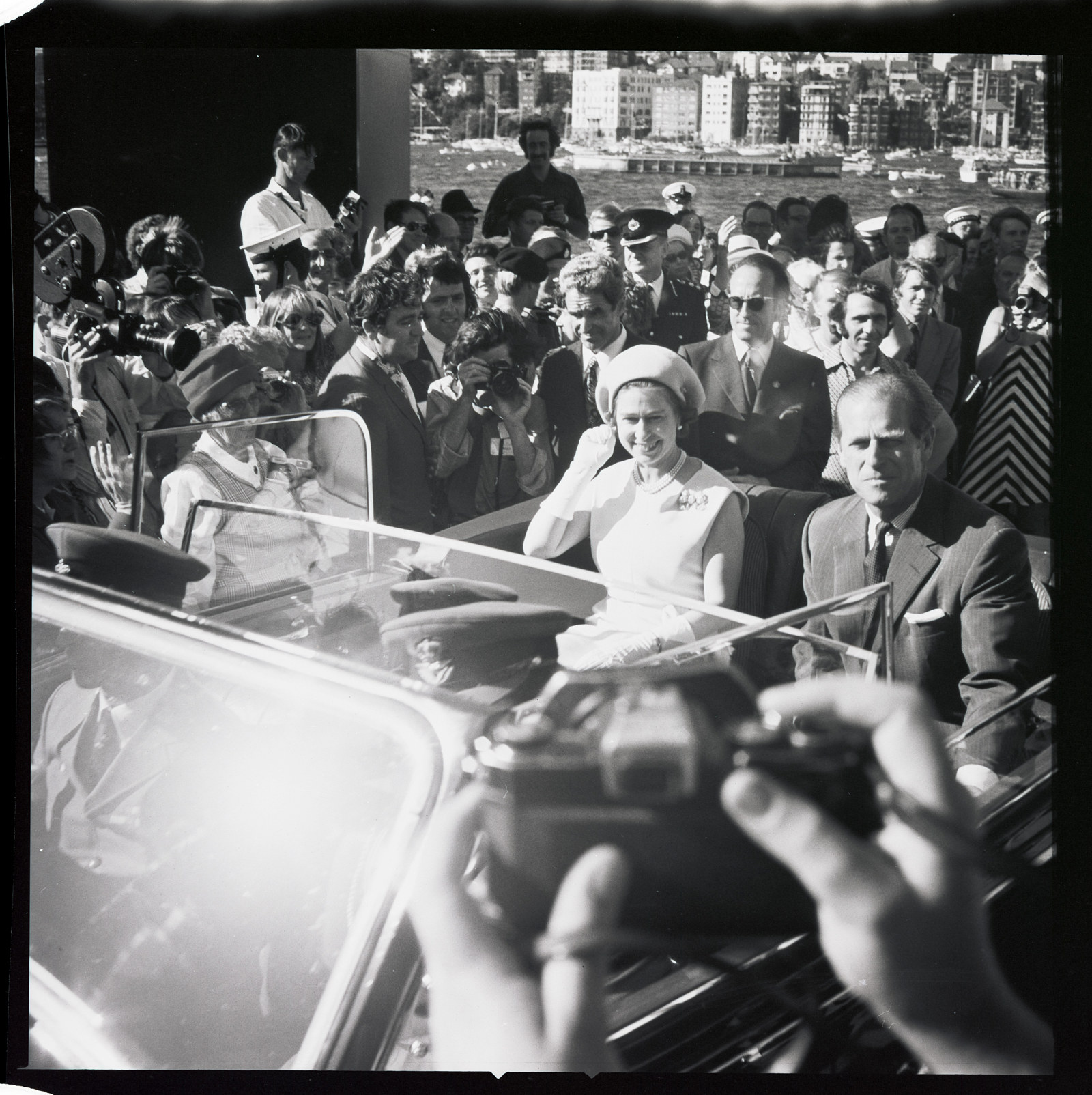 HM the Queen and Duke of Edinburgh leaving the forecourt in an open-top car following the opening ceremony and their tour of the Opera House, 20th October 1973.