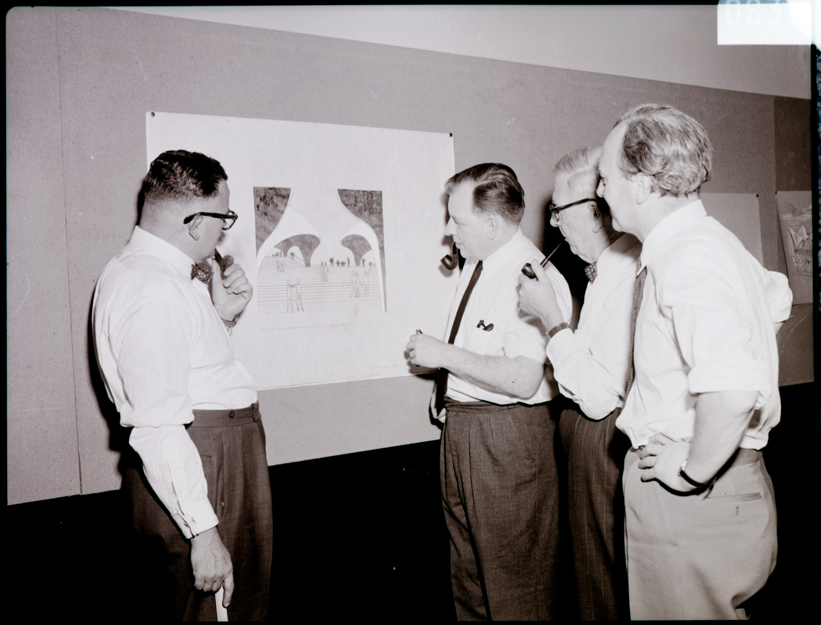 Government Printing Office 2 - 08373 - Opera House judging committee at Art Gallery [Department of Local Government; National Art Gallery of New South Wales; interiors; architects; architectural features; public servants] [GPO original locations or series - 47924] [11/1/1957]