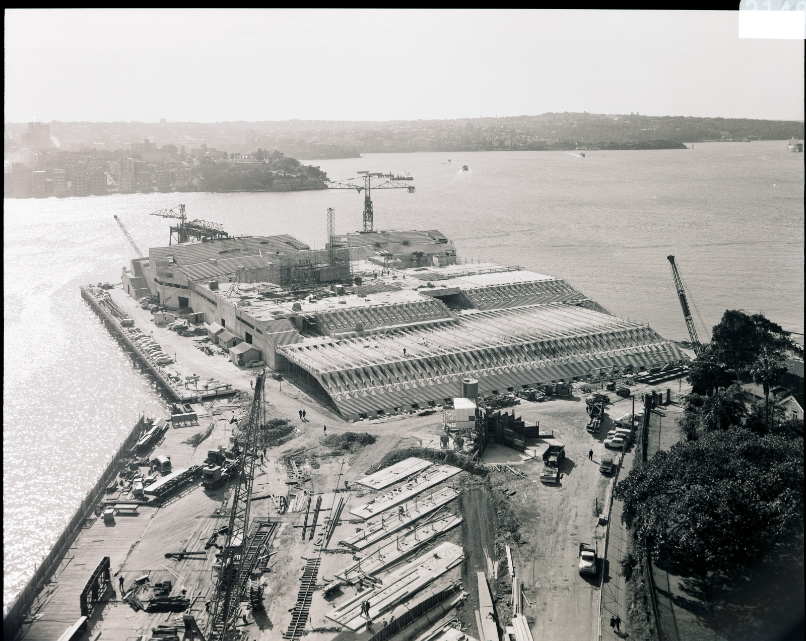 Government Printing Office 2 - 21486 - Sydney Opera House, progress shot from Unilever House [Public Works; building construction; harbours] [GPO original locations or series - St62359] [28/05/1963]